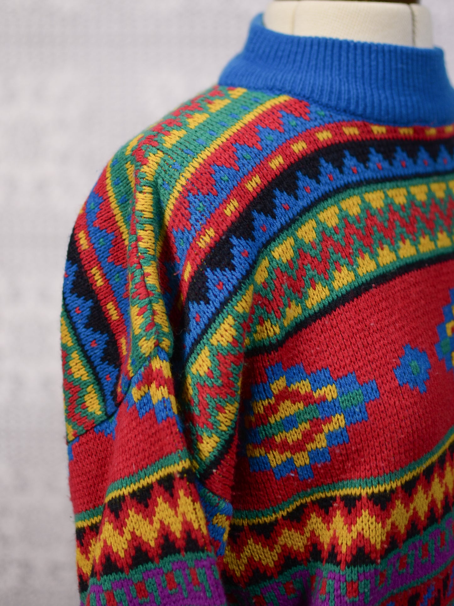 1990s blue, red and yellow colourful geometric floral patterned jumper