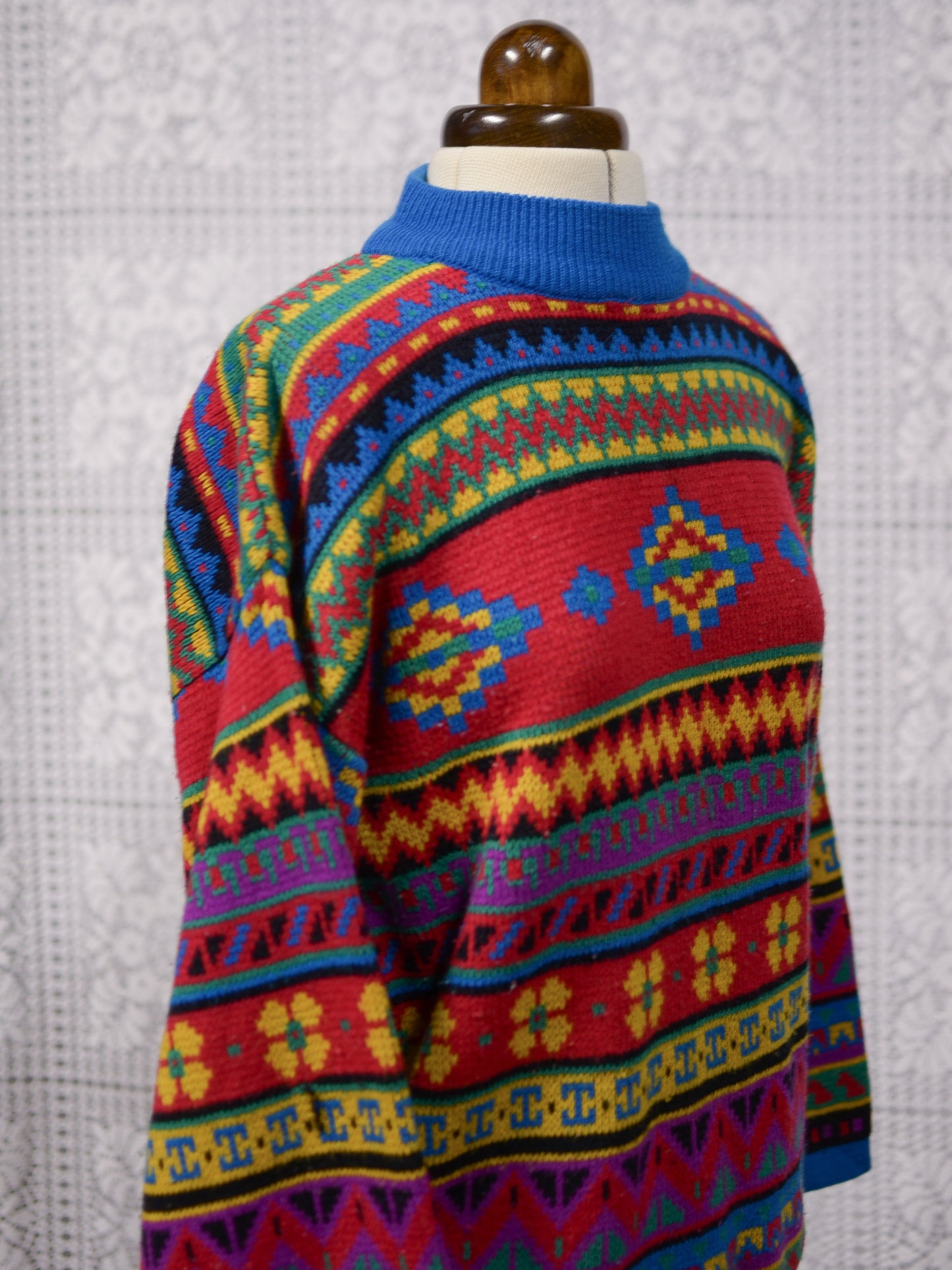 1990s blue, red and yellow colourful geometric floral patterned jumper