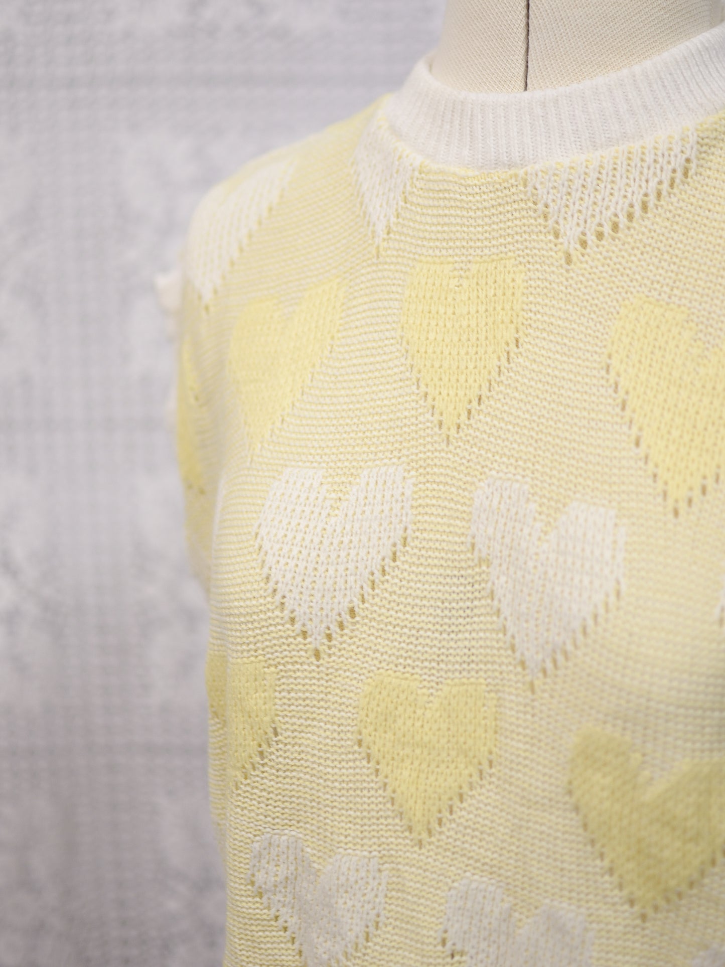1980s pastel yellow and white heart pattern sleeveless jumper