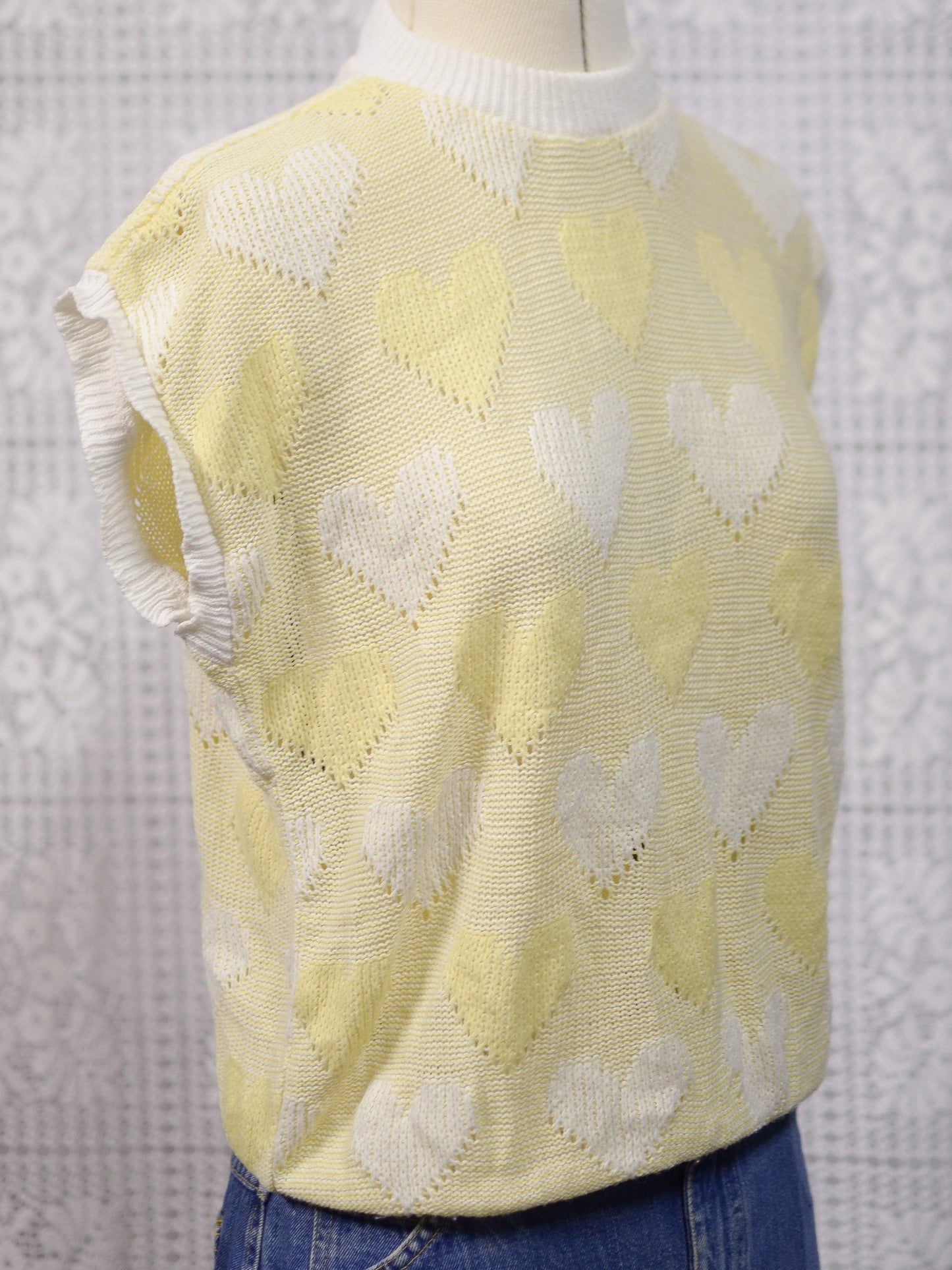 1980s pastel yellow and white heart pattern sleeveless jumper