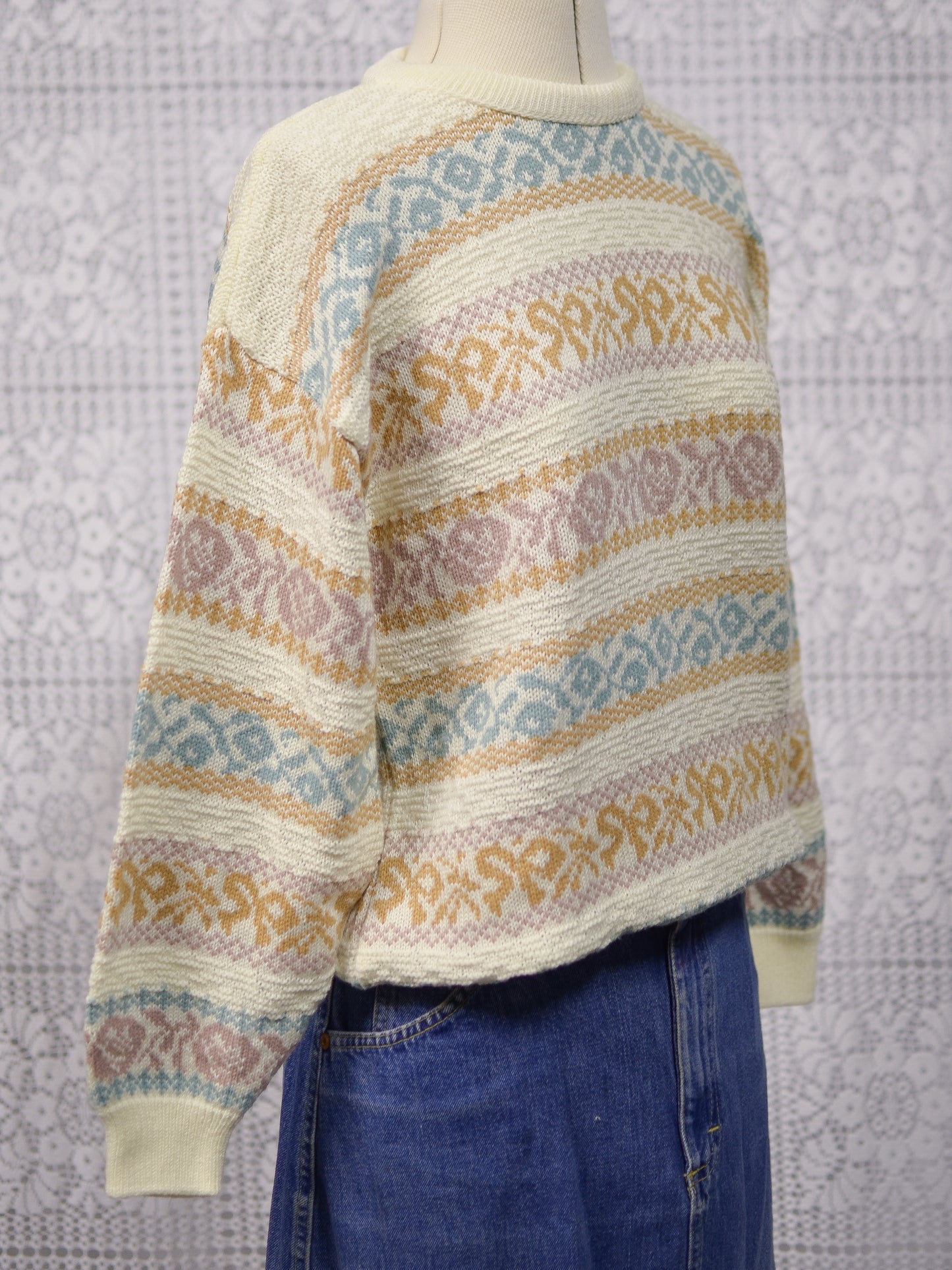1980s cream and pastel colour floral and bow pattern stripe jumper