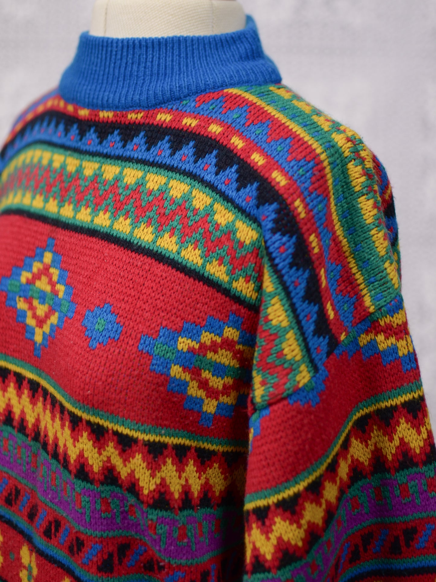 1990s blue, red and yellow colourful geometric floral patterned jumper