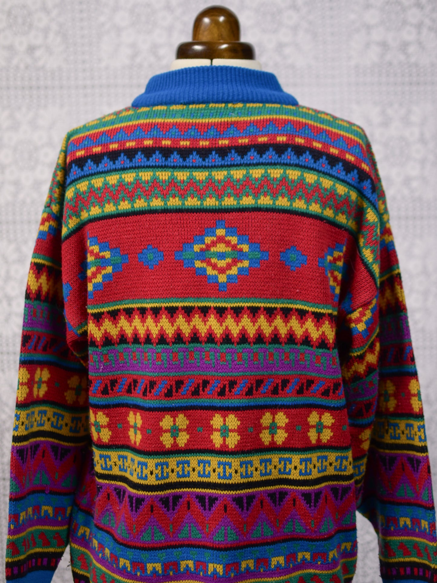 1990s blue, red and yellow colourful geometric floral patterned jumper