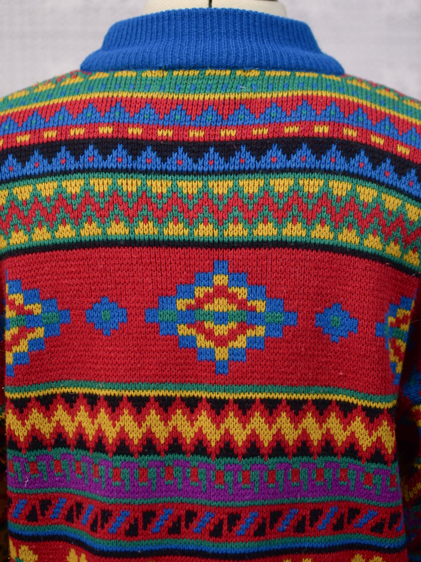 1990s blue, red and yellow colourful geometric floral patterned jumper