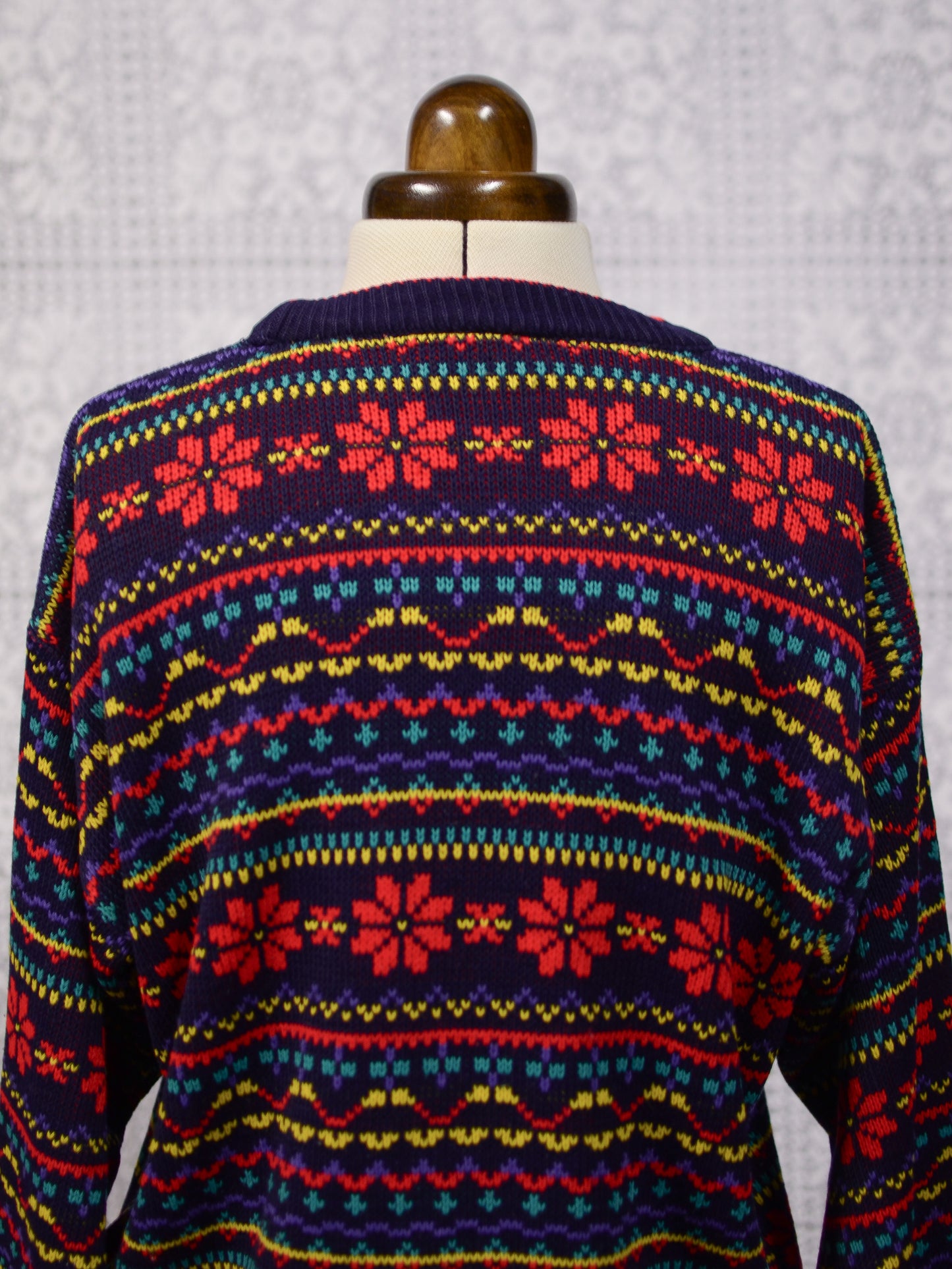 1990s Dorothy Perkins navy blue, red and yellow snowflake festive jumper