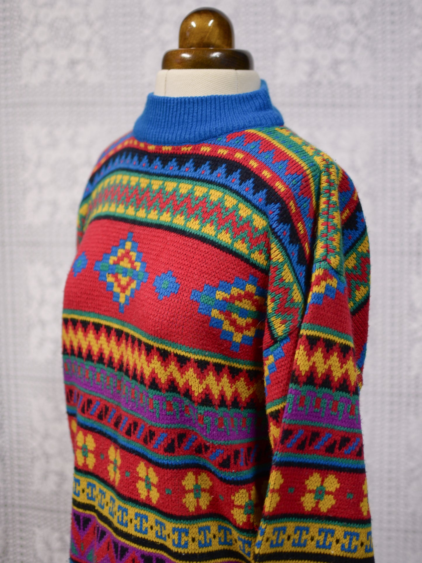 1990s blue, red and yellow colourful geometric floral patterned jumper