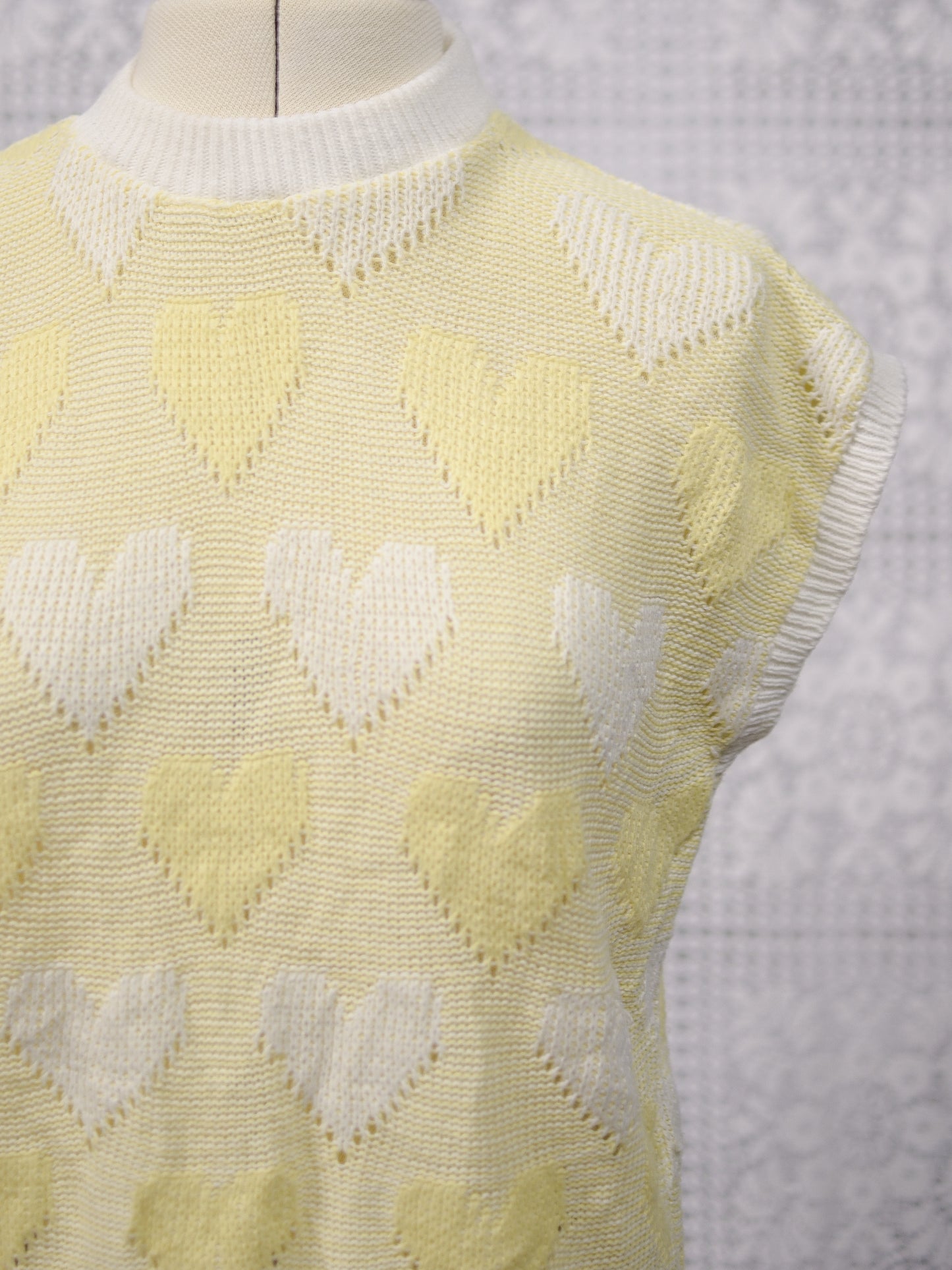 1980s pastel yellow and white heart pattern sleeveless jumper