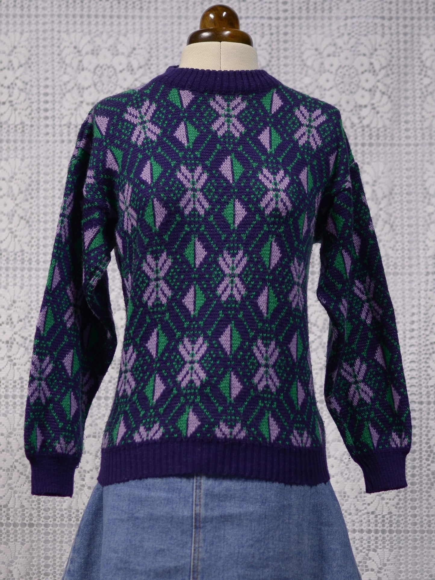 1970s blue, purple and green nordic style snowflake festive jumper