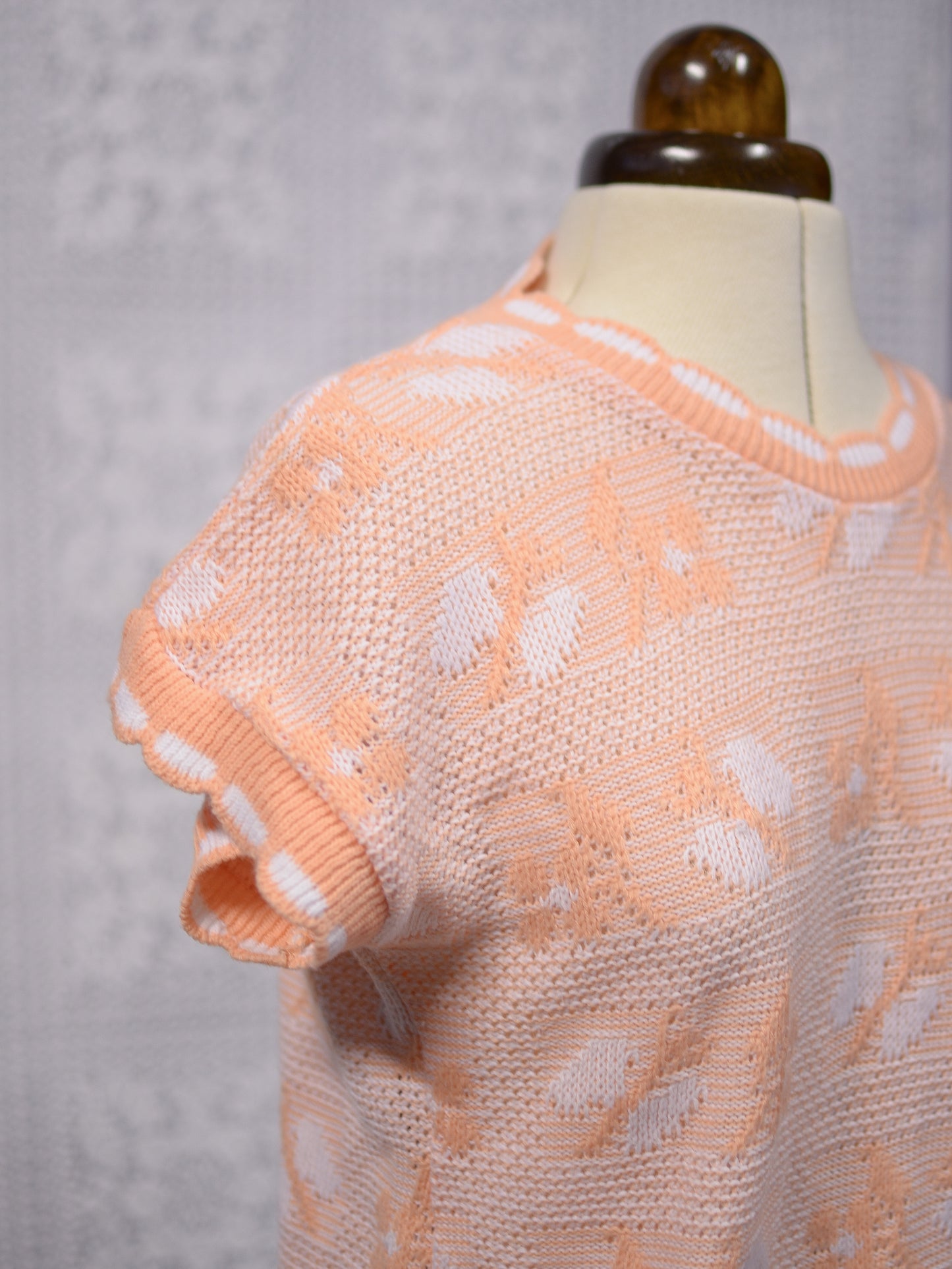 1980s peachy orange and white sleeveless jumper sweater vest