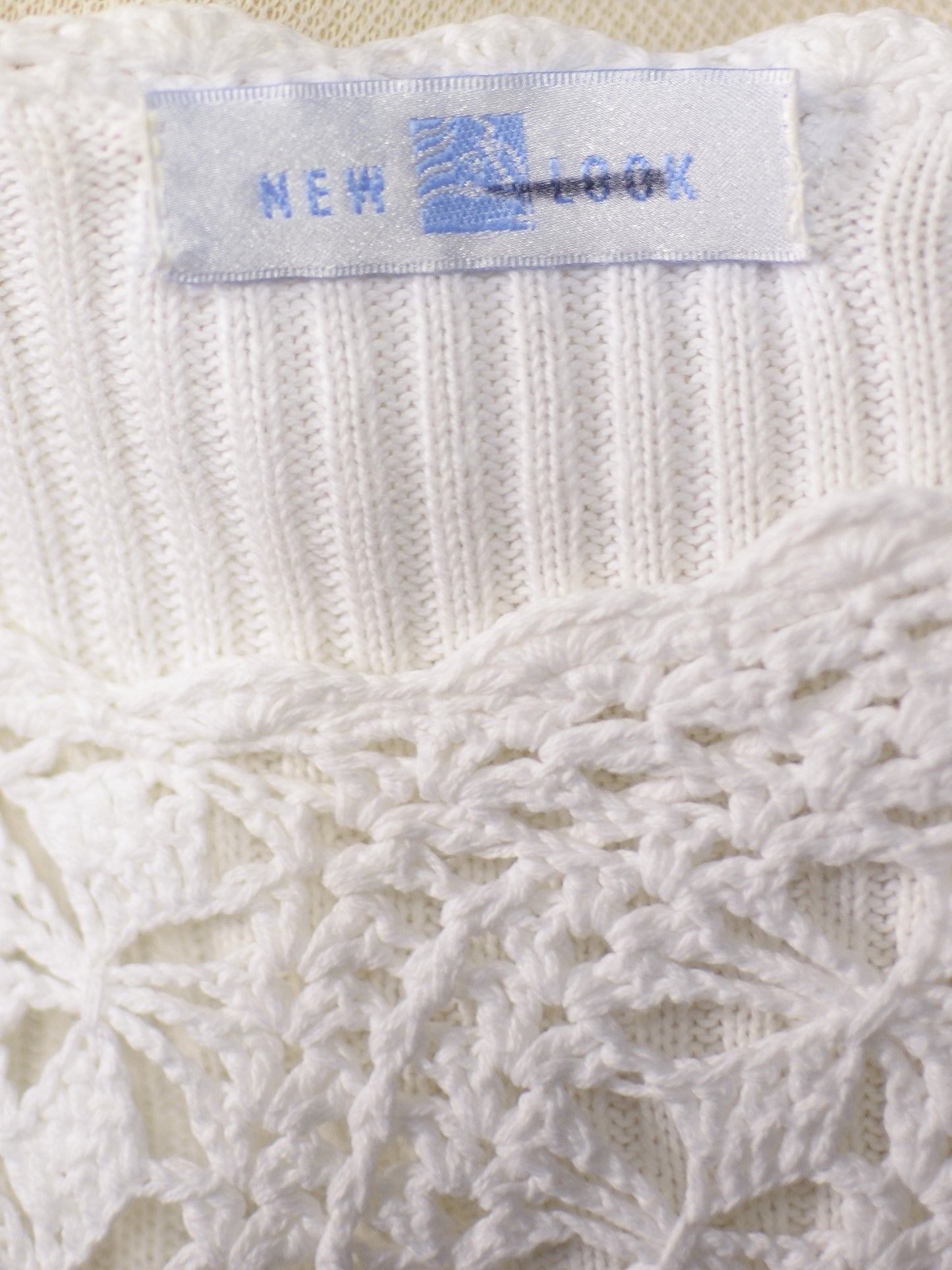 1990s New Look white crocheted short sleeve cardigan with shell buttons