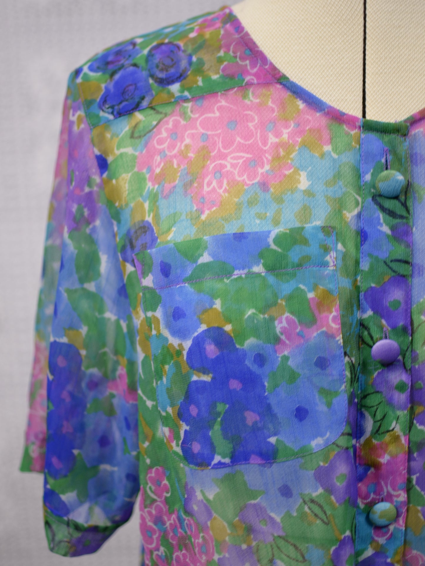 1980s blue, pink and green floral sheer button-up tie waist short sleeve blouse