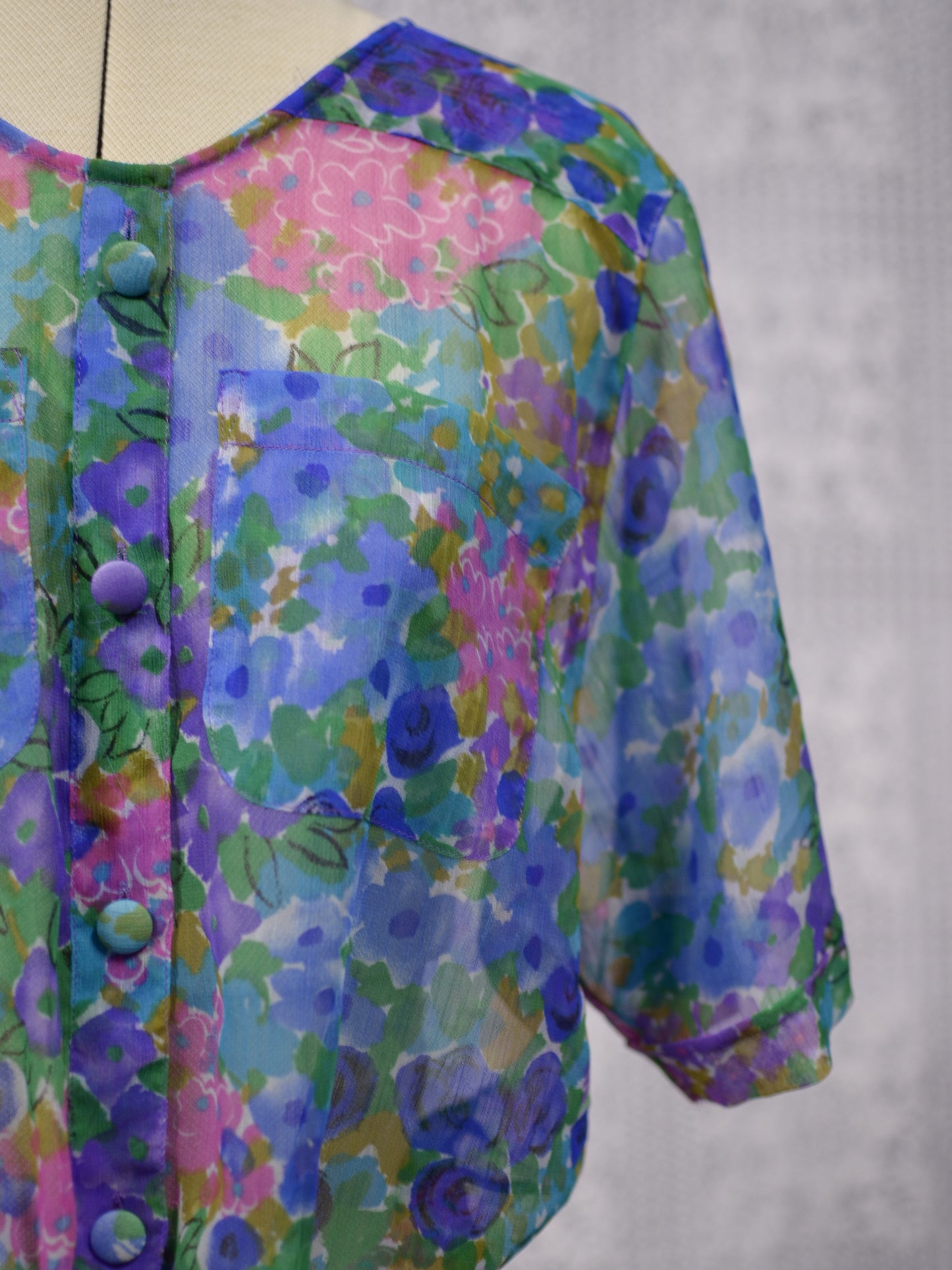 1980s blue, pink and green floral sheer button-up tie waist short sleeve blouse