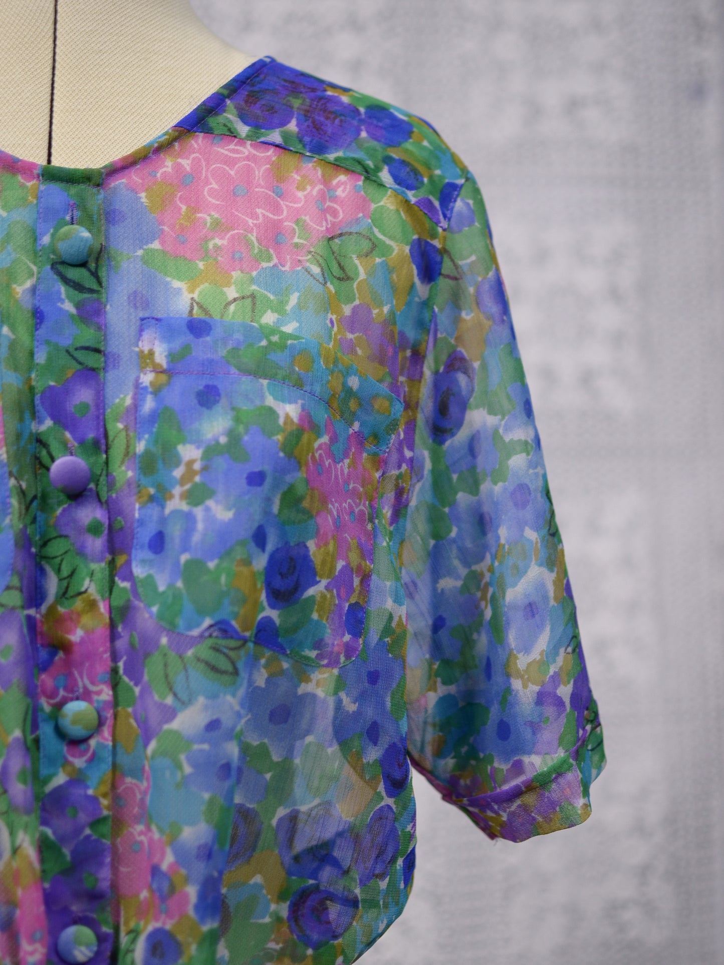 1980s blue, pink and green floral sheer button-up tie waist short sleeve blouse