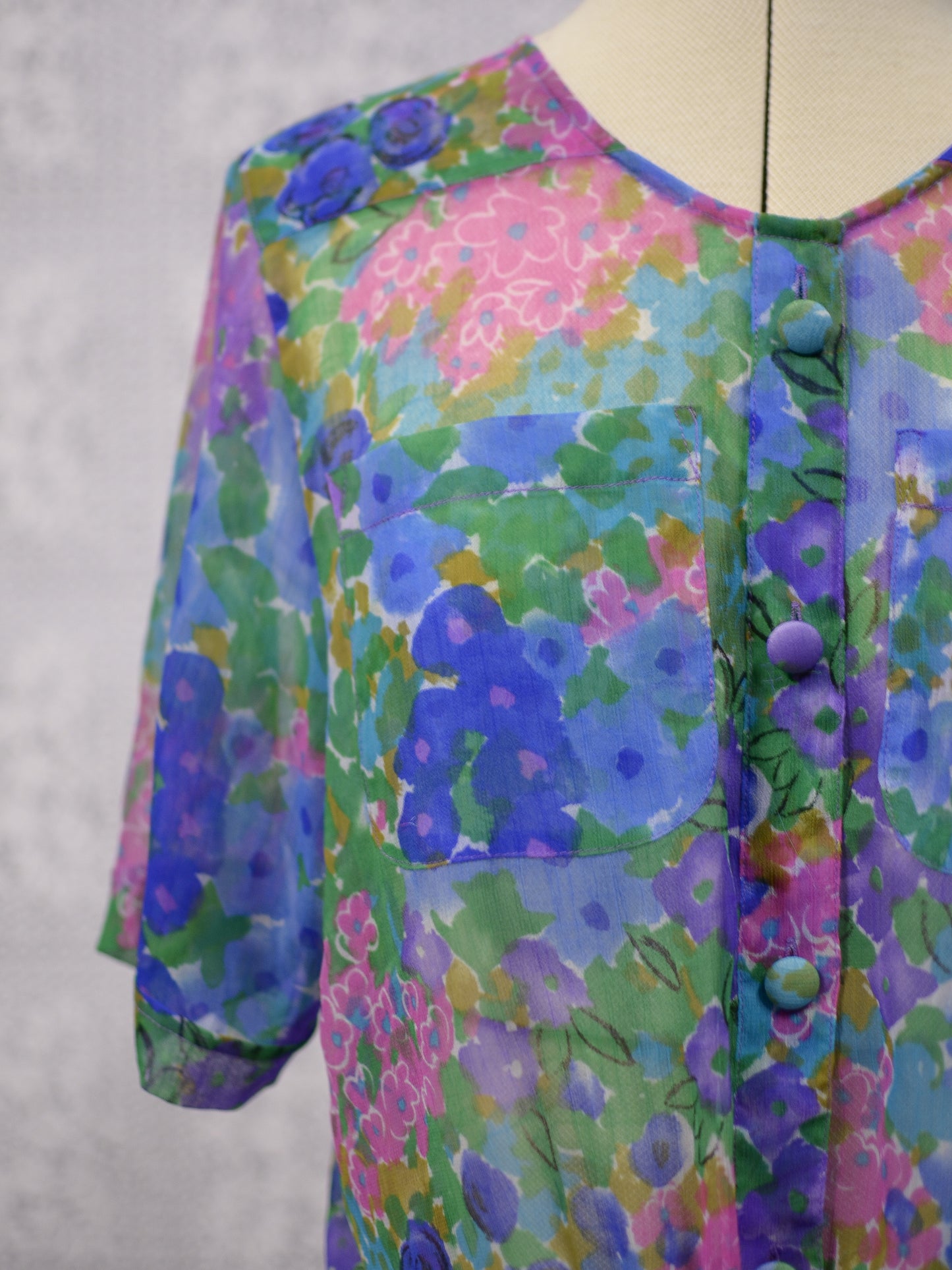 1980s blue, pink and green floral sheer button-up tie waist short sleeve blouse