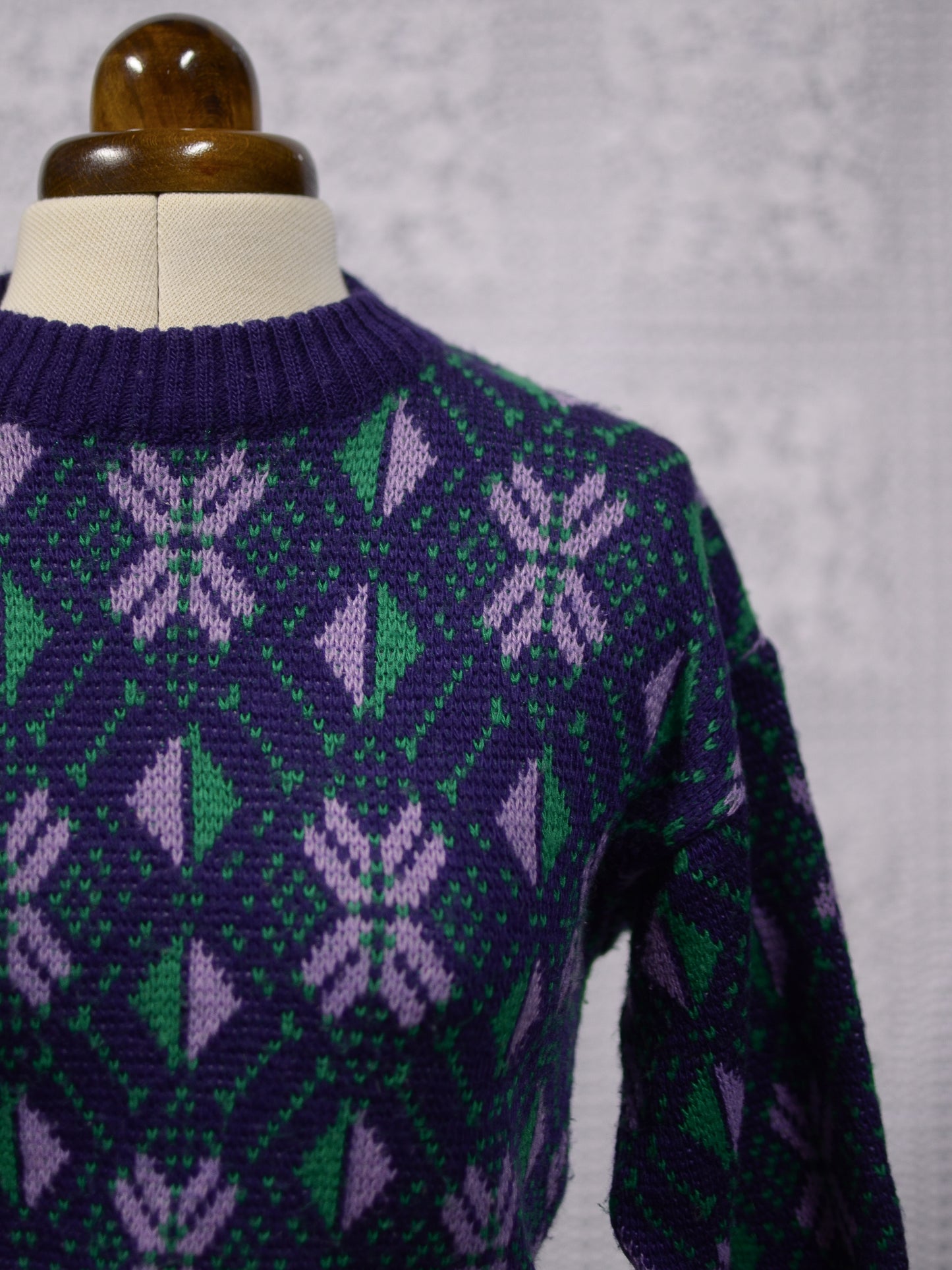 1970s blue, purple and green nordic style snowflake festive jumper