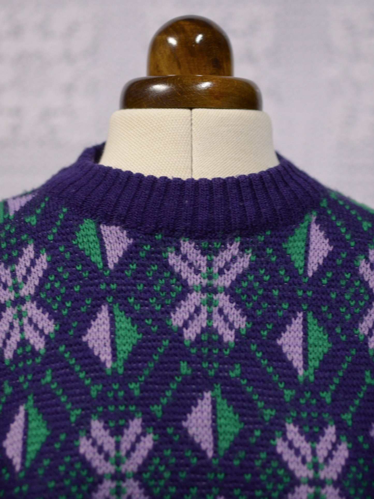 1970s blue, purple and green nordic style snowflake festive jumper