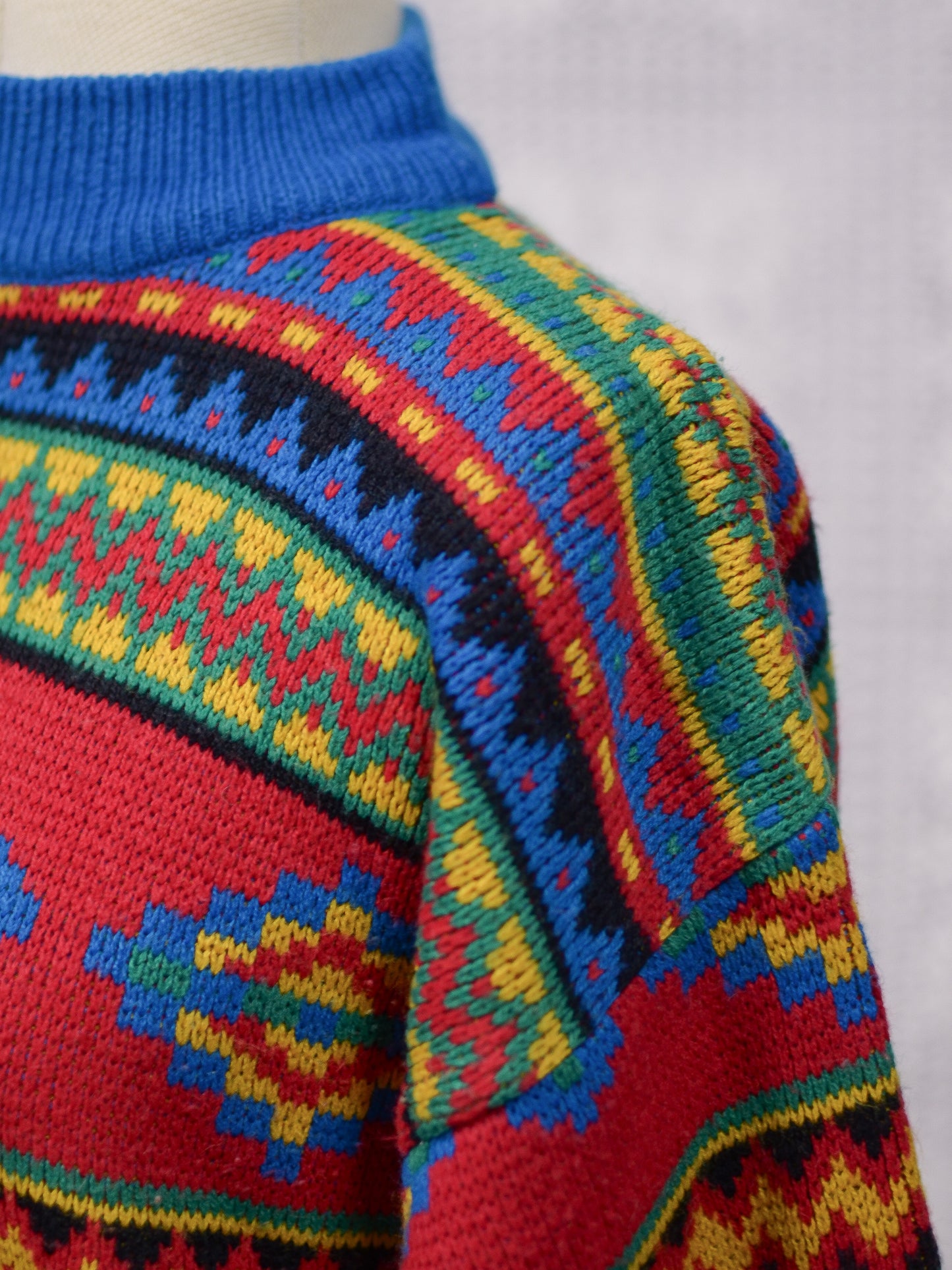 1990s blue, red and yellow colourful geometric floral patterned jumper