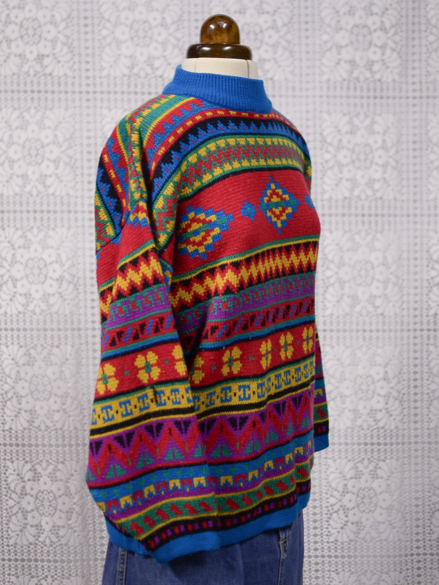 1990s blue, red and yellow colourful geometric floral patterned jumper