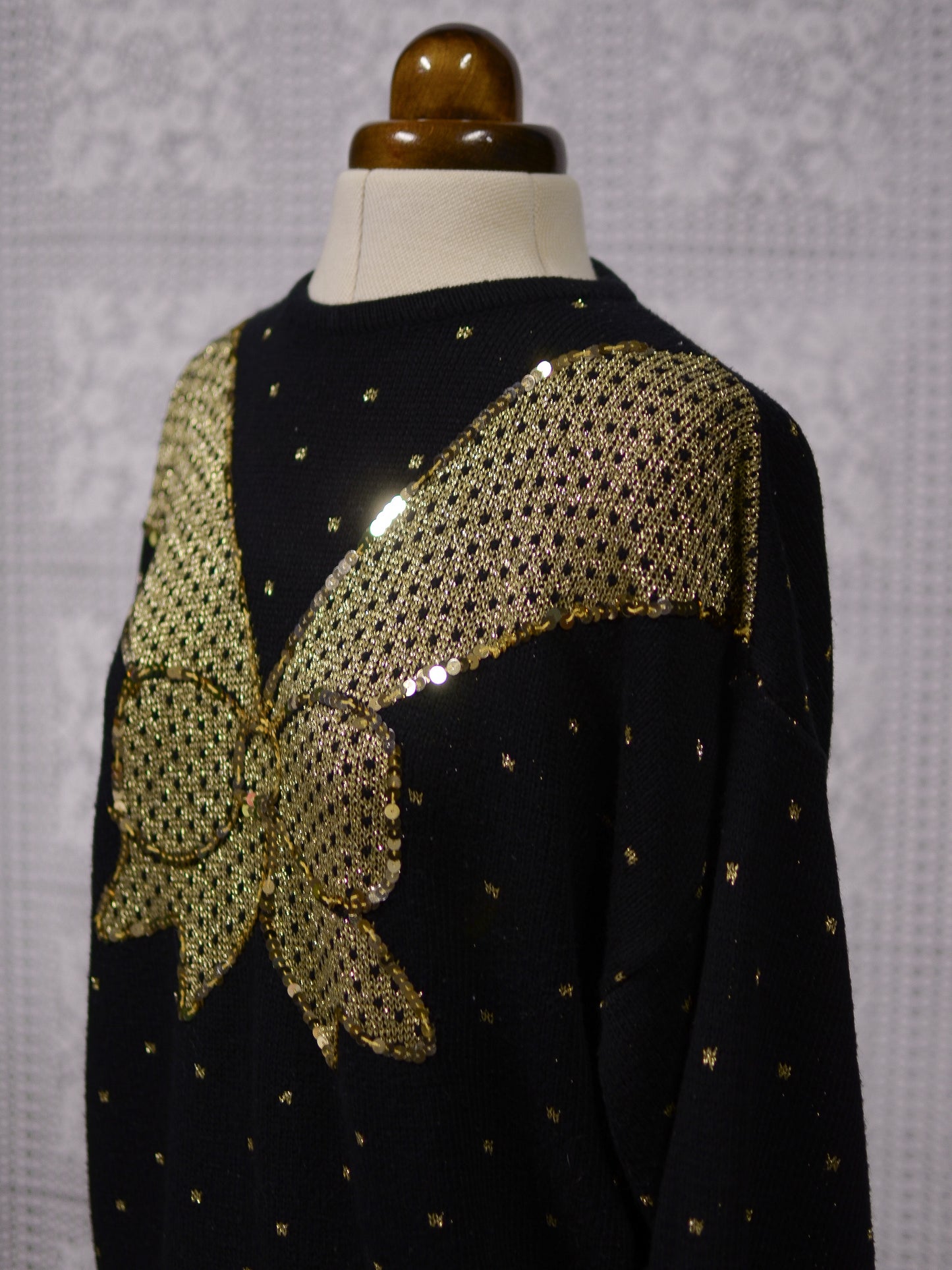 1980s black and gold glittery sequin bow jumper