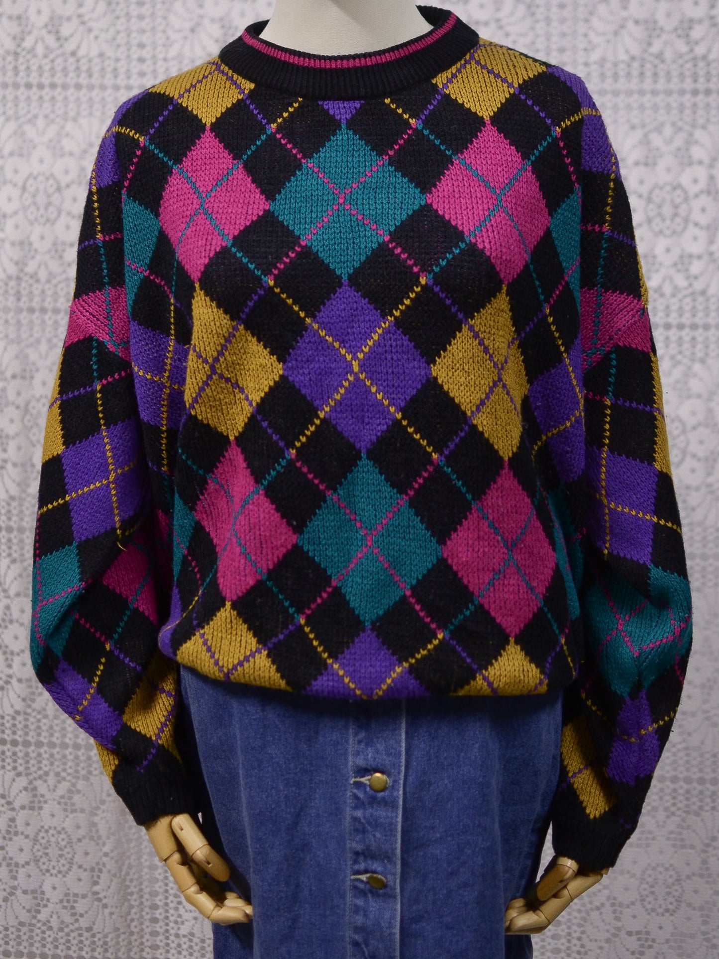 1980s black, pink, yellow, purple and turquoise green argyle pattern jumper