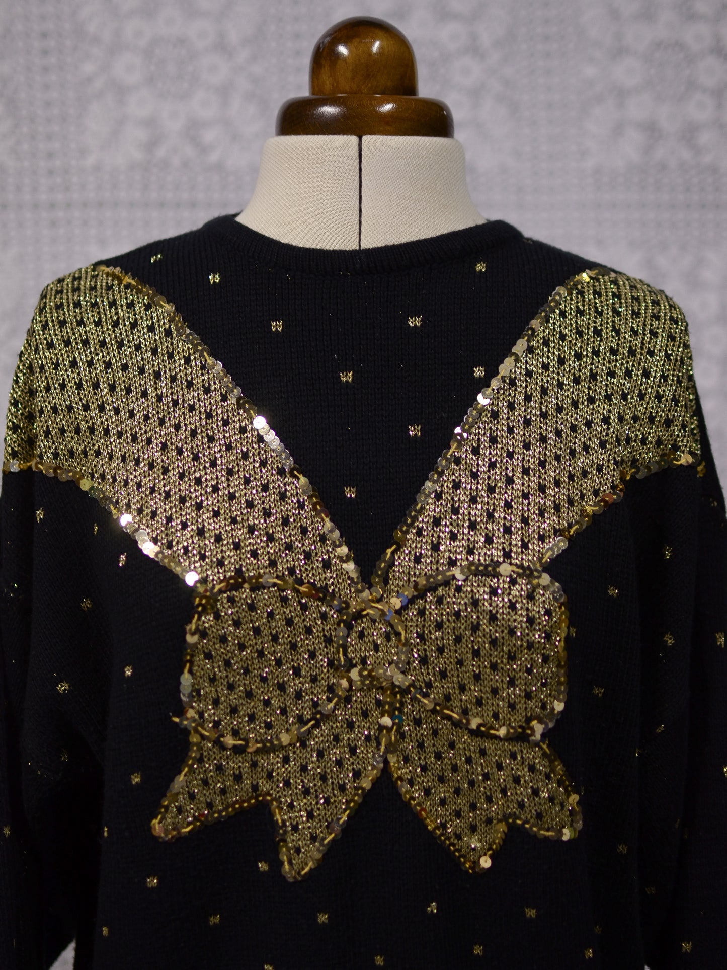 1980s black and gold glittery sequin bow jumper