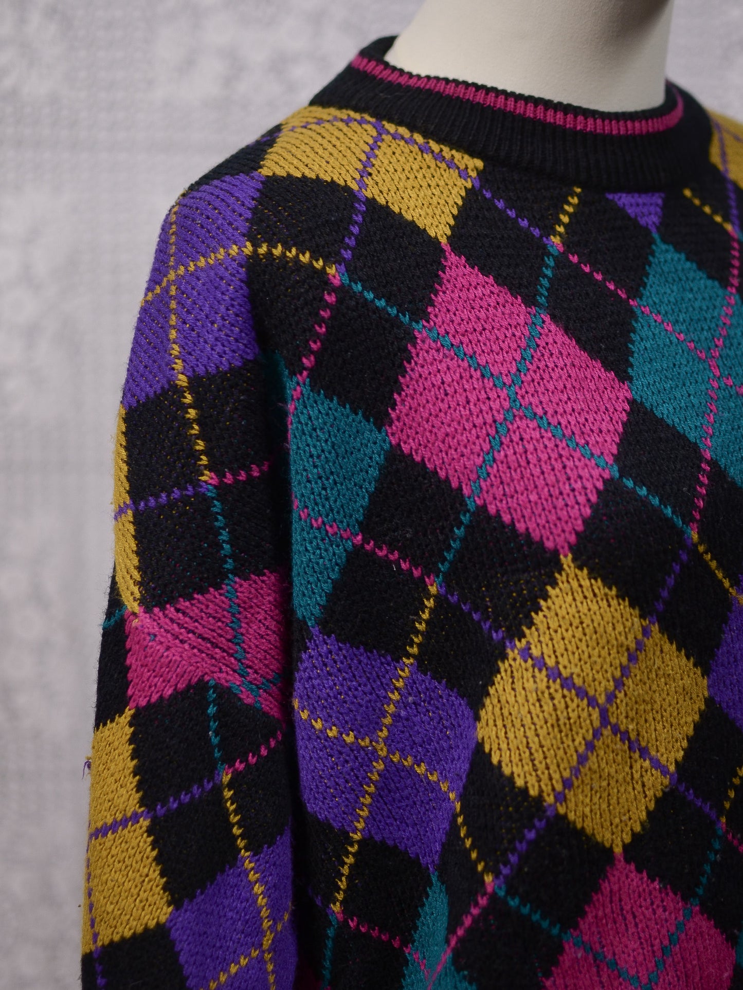 1980s black, pink, yellow, purple and turquoise green argyle pattern jumper