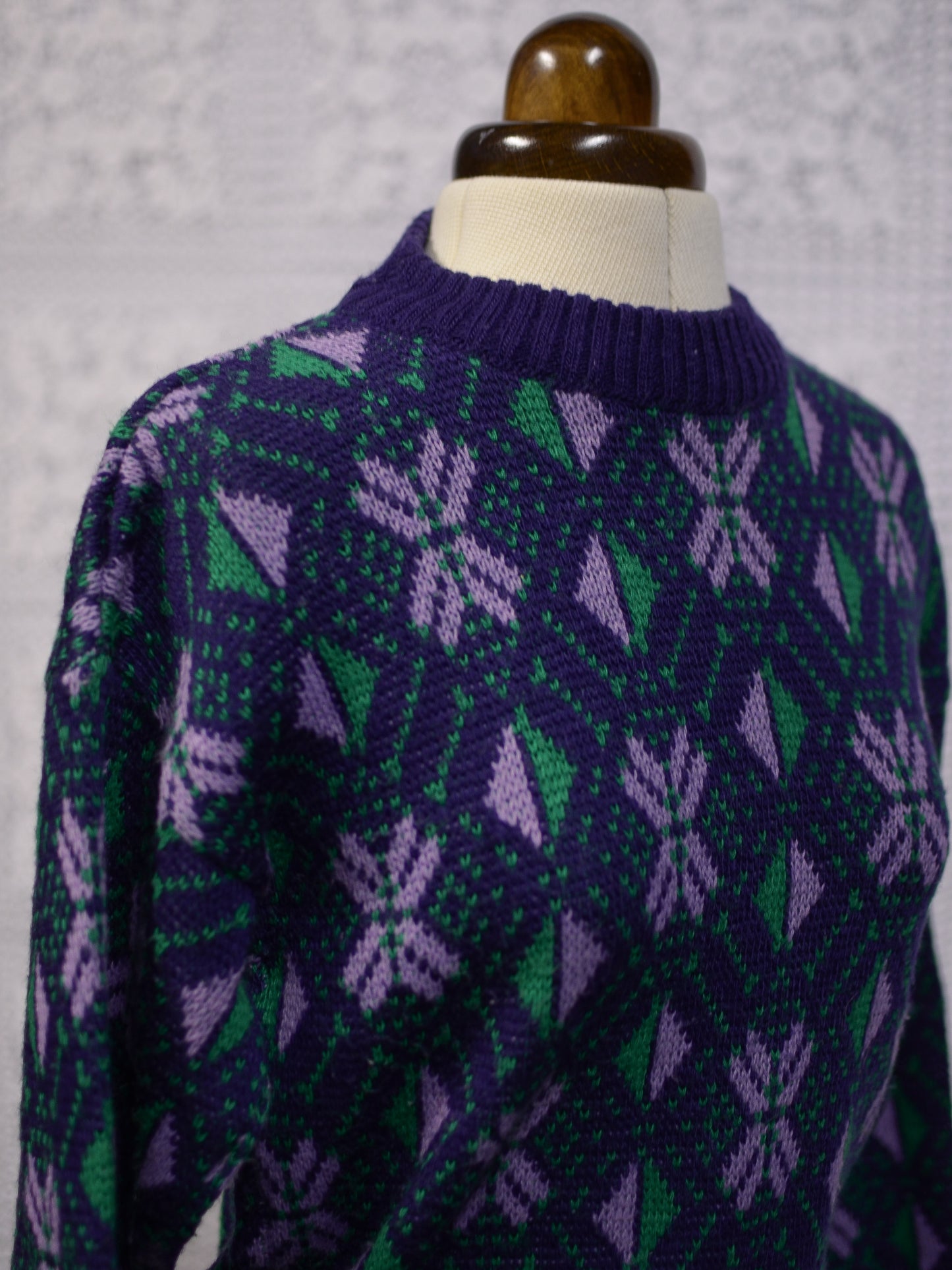 1970s blue, purple and green nordic style snowflake festive jumper