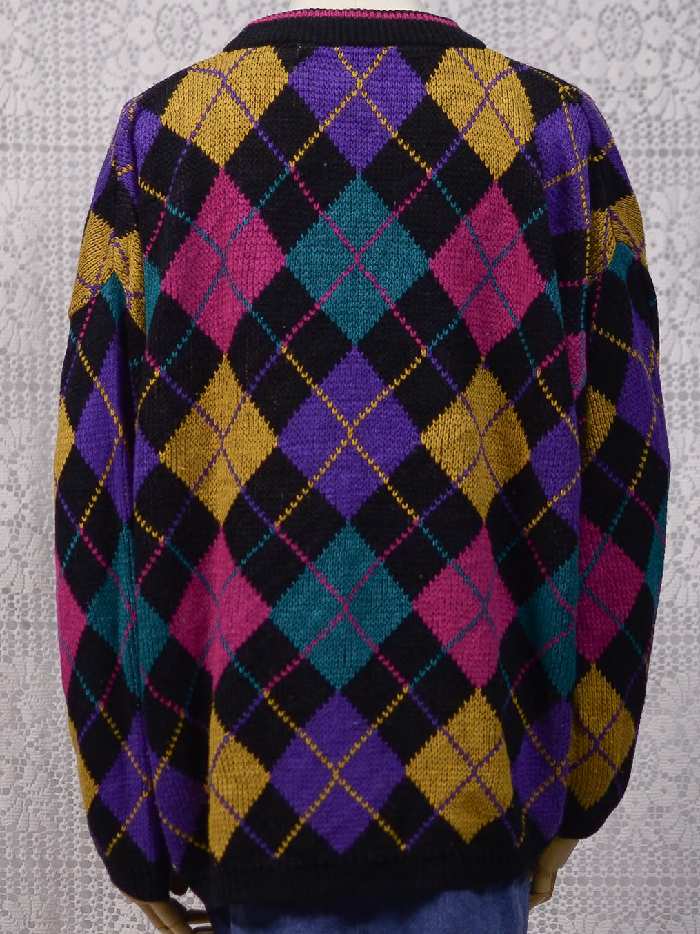 1980s black, pink, yellow, purple and turquoise green argyle pattern jumper