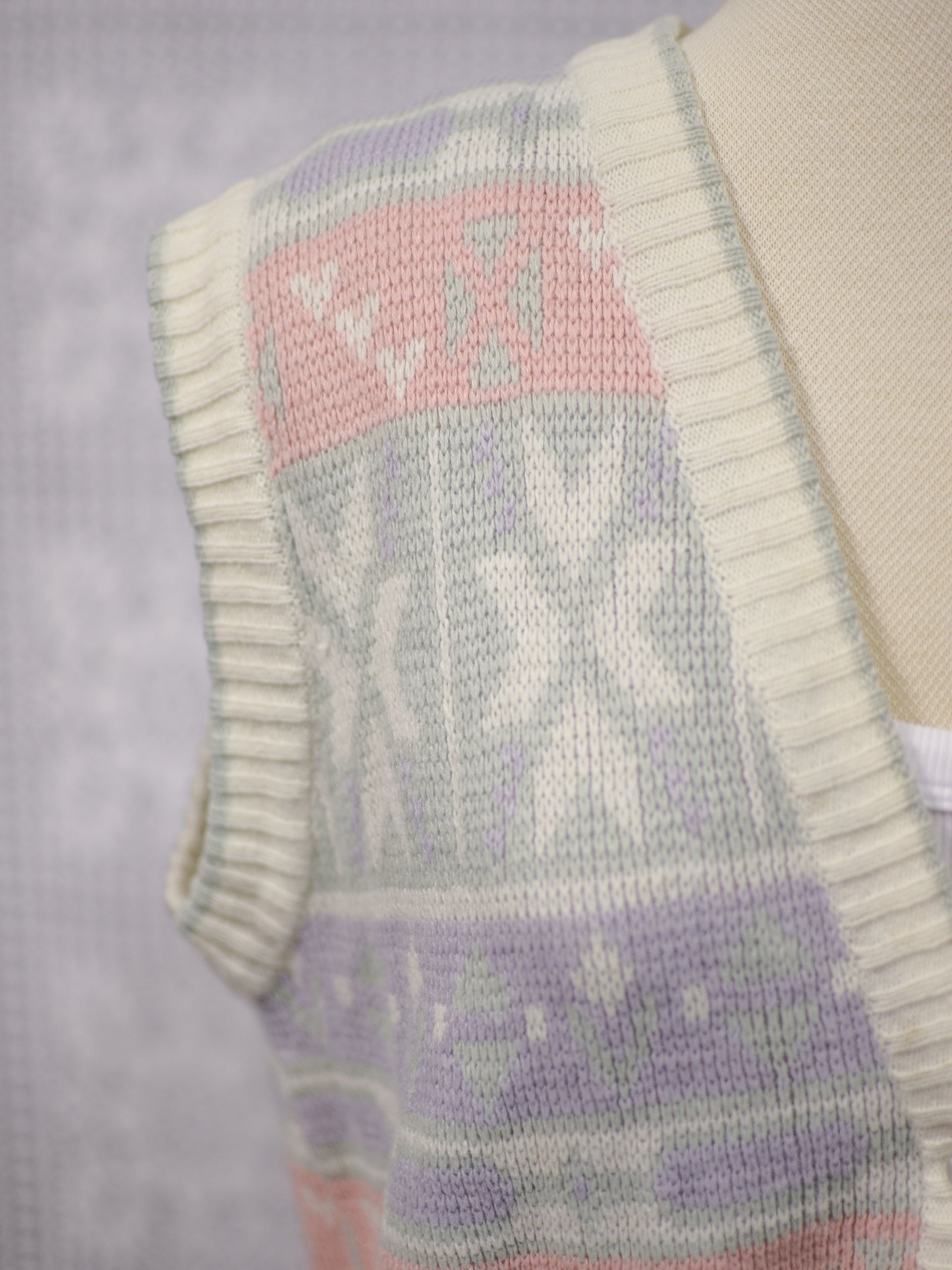 1980s white, pink, pastel blue and green snowflake festive knitted waistcoat