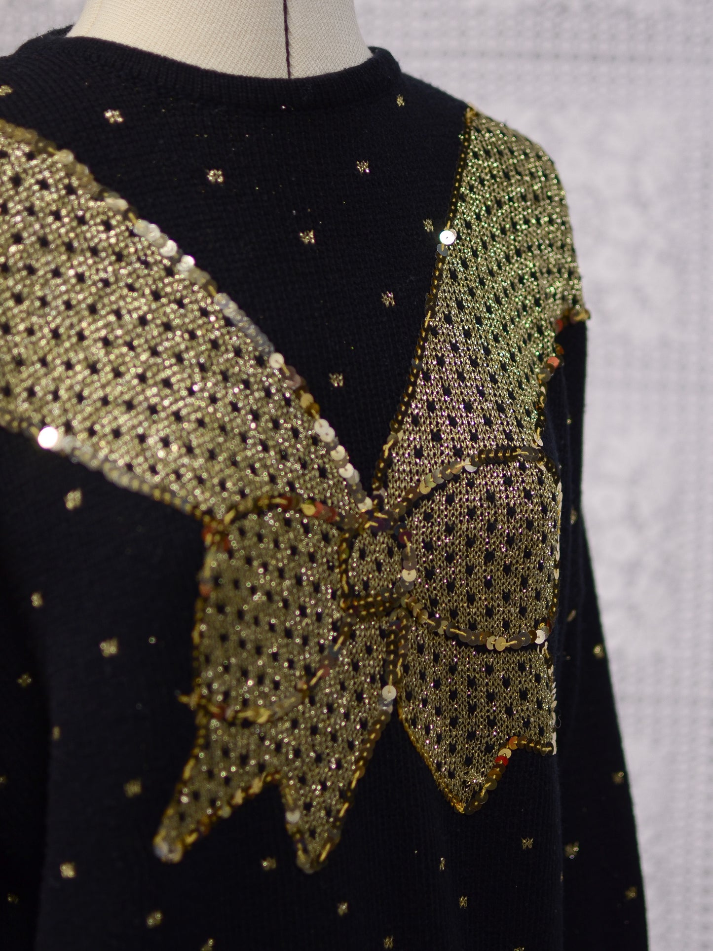 1980s black and gold glittery sequin bow jumper