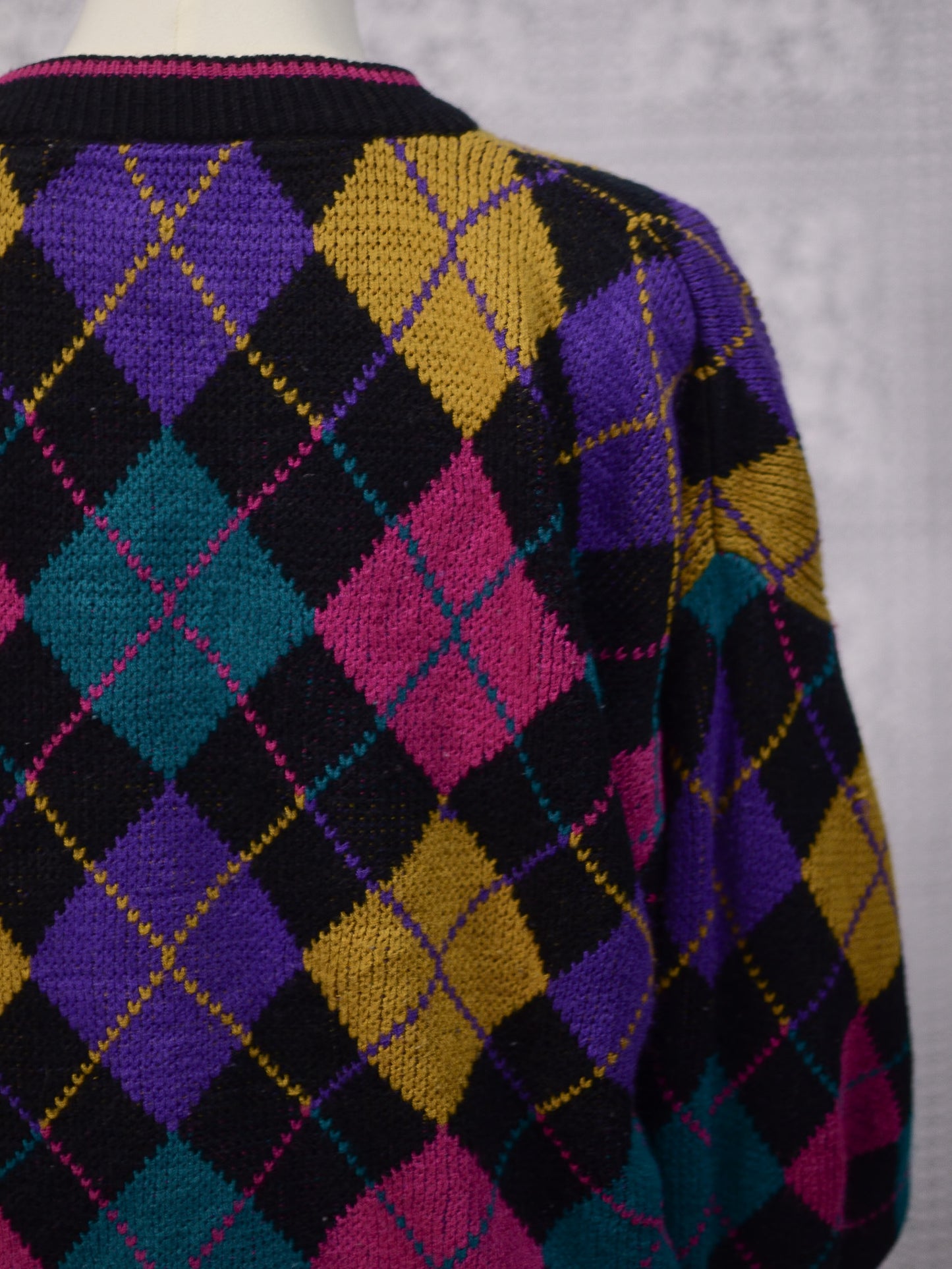 1980s black, pink, yellow, purple and turquoise green argyle pattern jumper