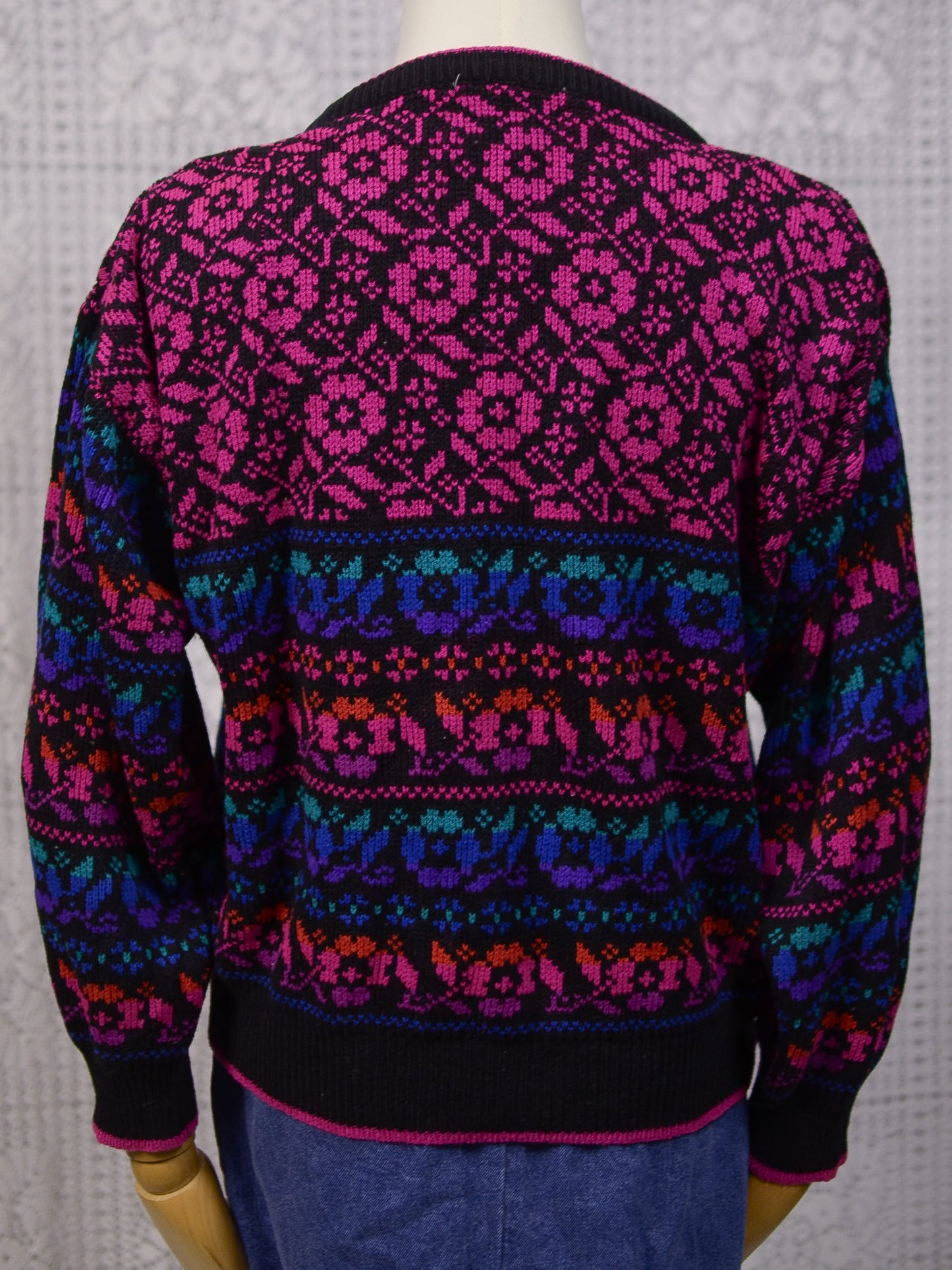 1980s black, pink, blue, purple and green floral pattern jumper
