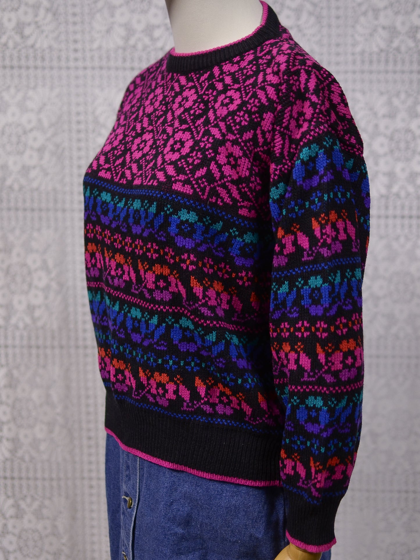 1980s black, pink, blue, purple and green floral pattern jumper