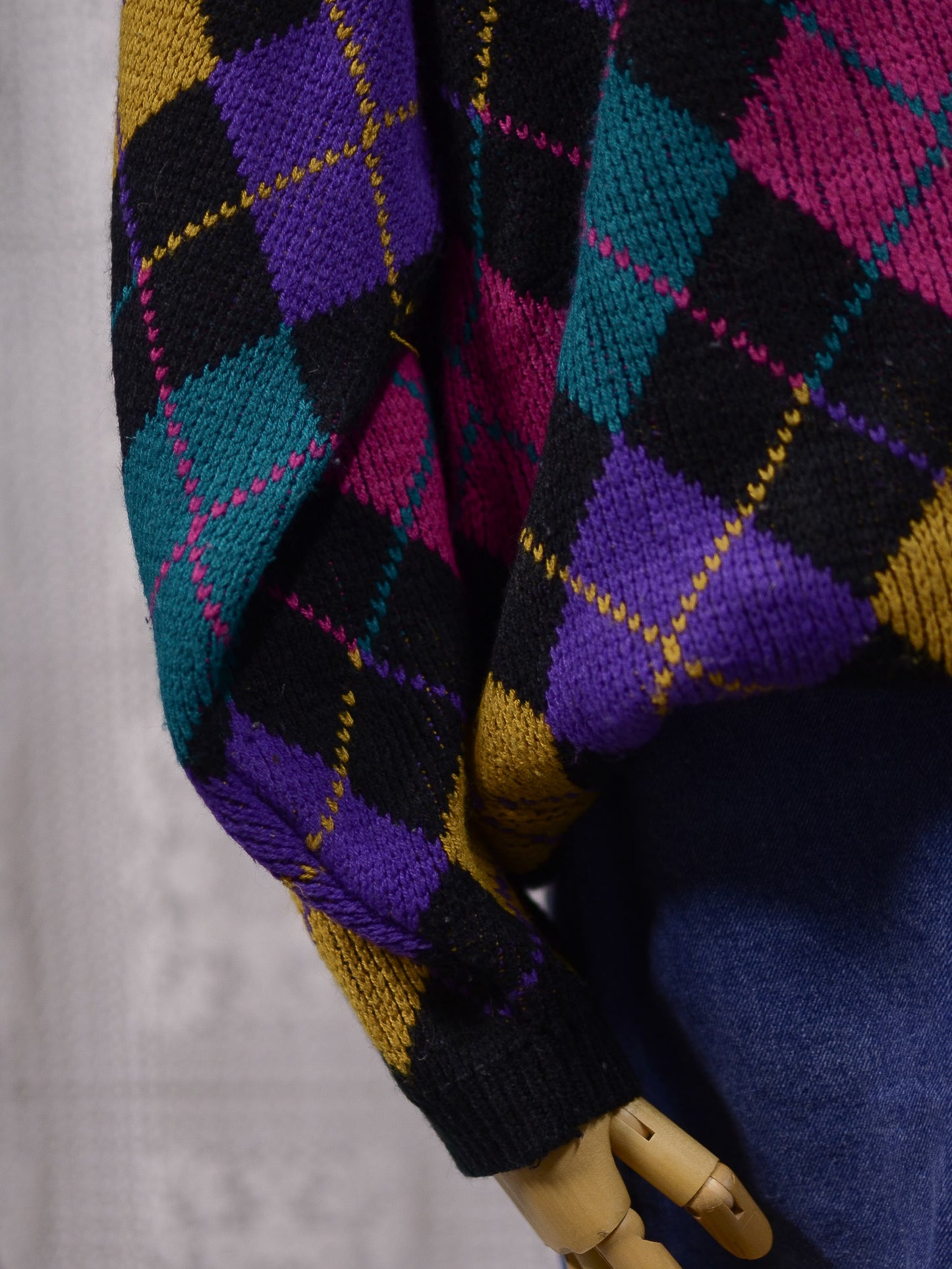 1980s black, pink, yellow, purple and turquoise green argyle pattern jumper