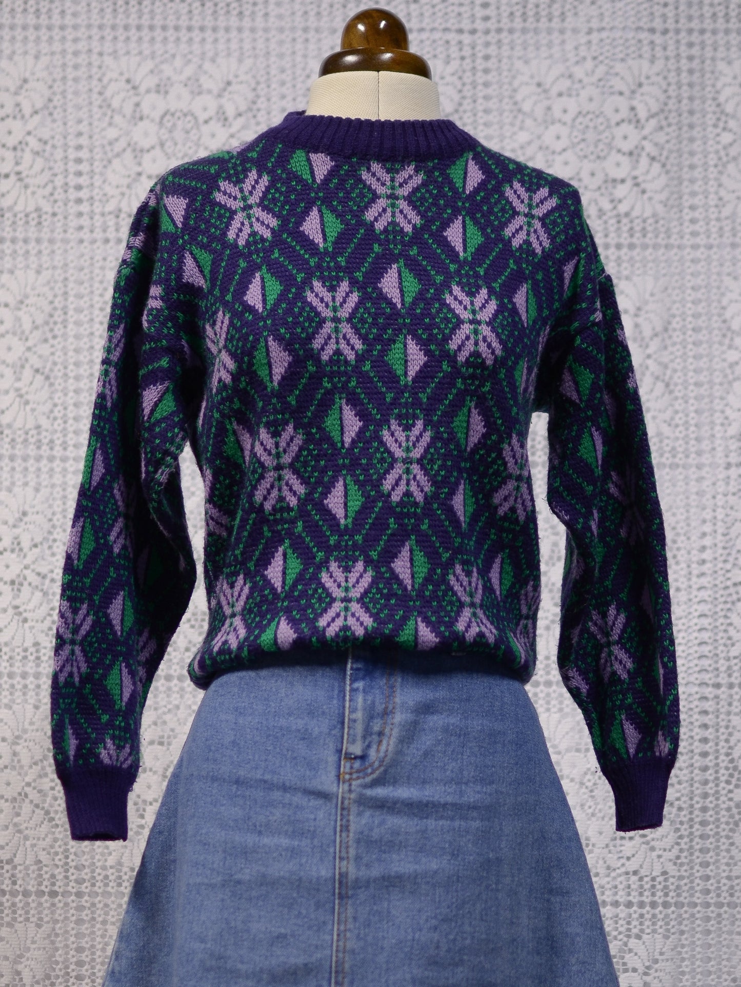 1970s blue, purple and green nordic style snowflake festive jumper