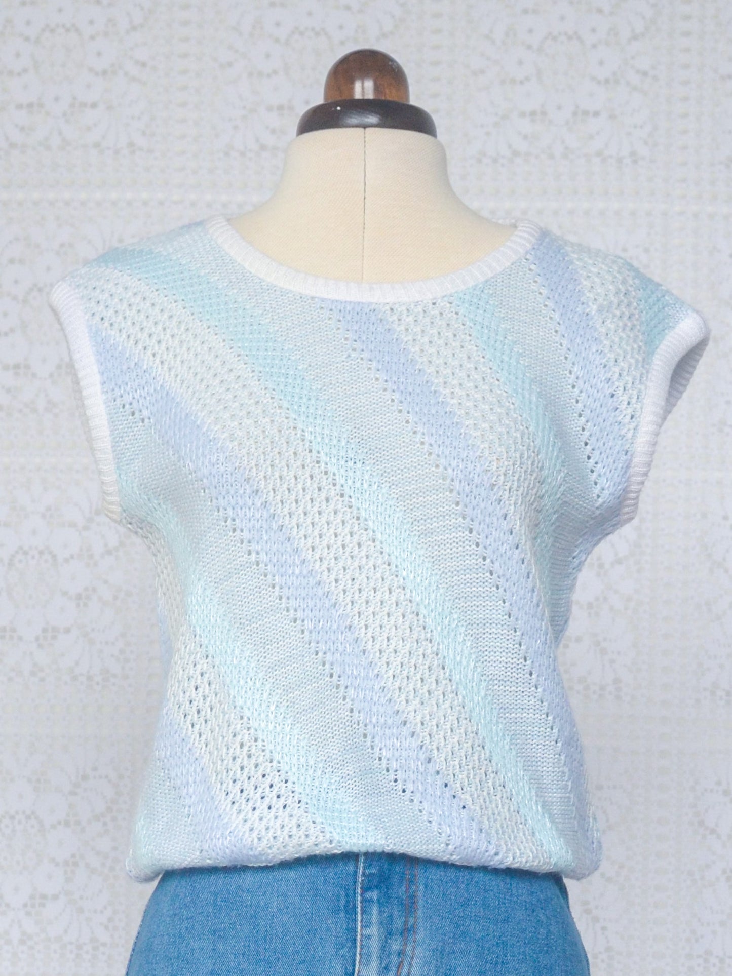 1980s style pale blue and white diagonal stripe cropped sleeveless jumper