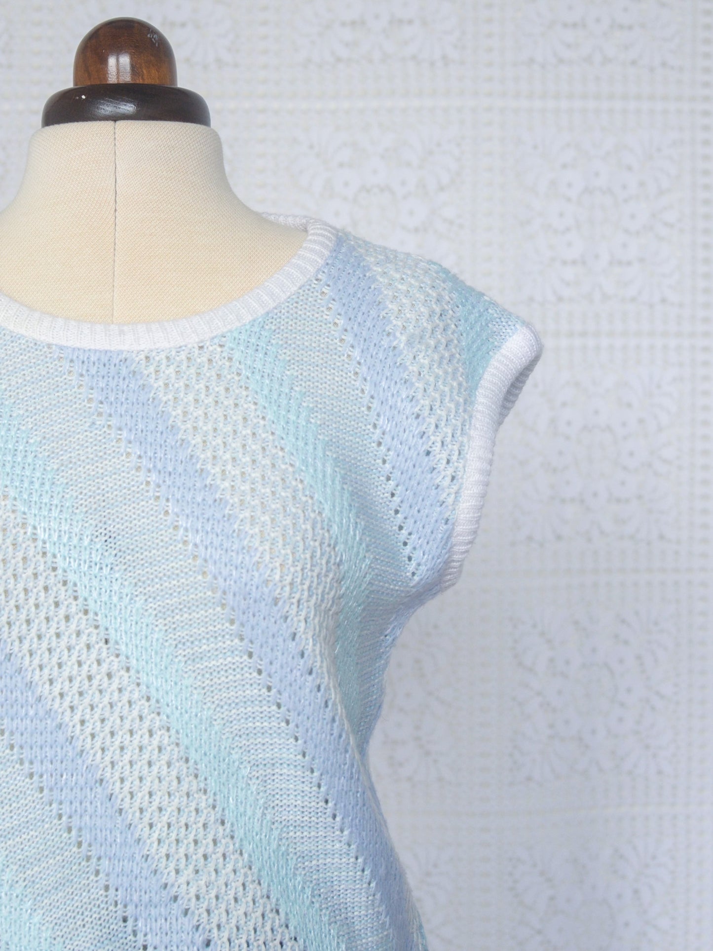 1980s style pale blue and white diagonal stripe cropped sleeveless jumper