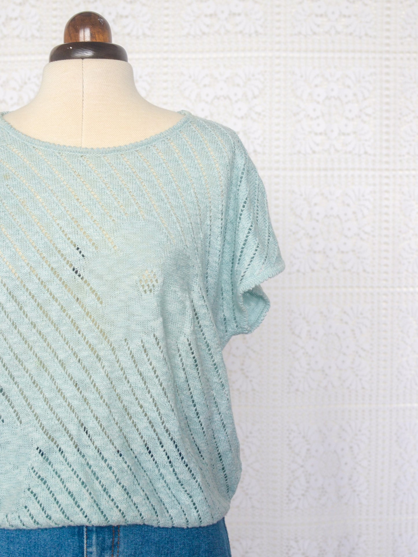 1980s style pale turquoise knitted short sleeve jumper with flower pattern