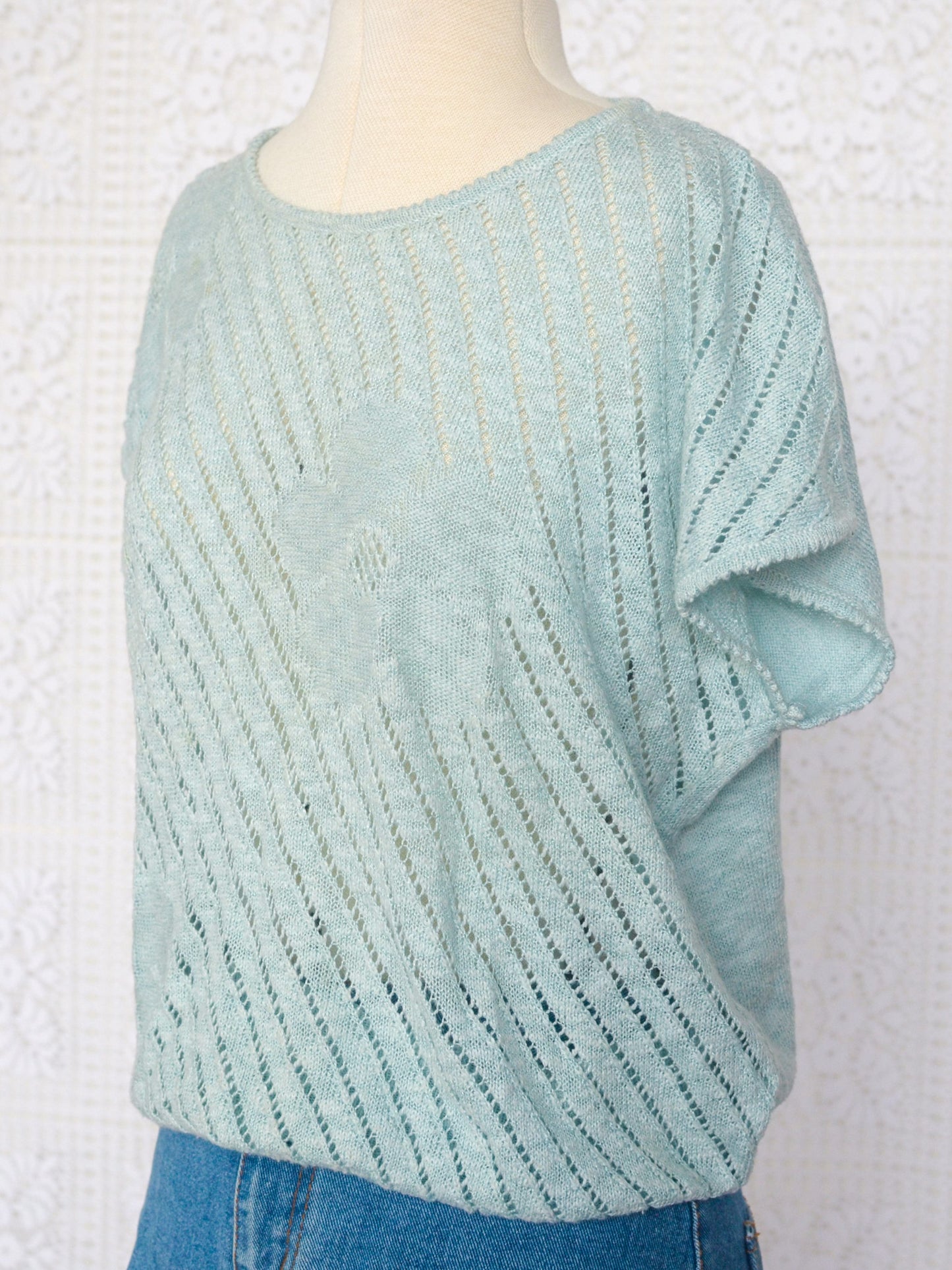 1980s style pale turquoise knitted short sleeve jumper with flower pattern