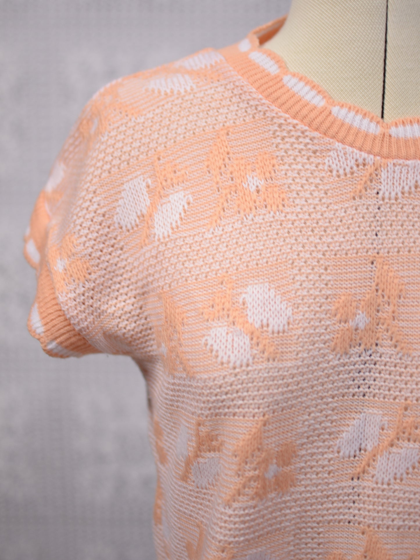 1980s peachy orange and white sleeveless jumper sweater vest