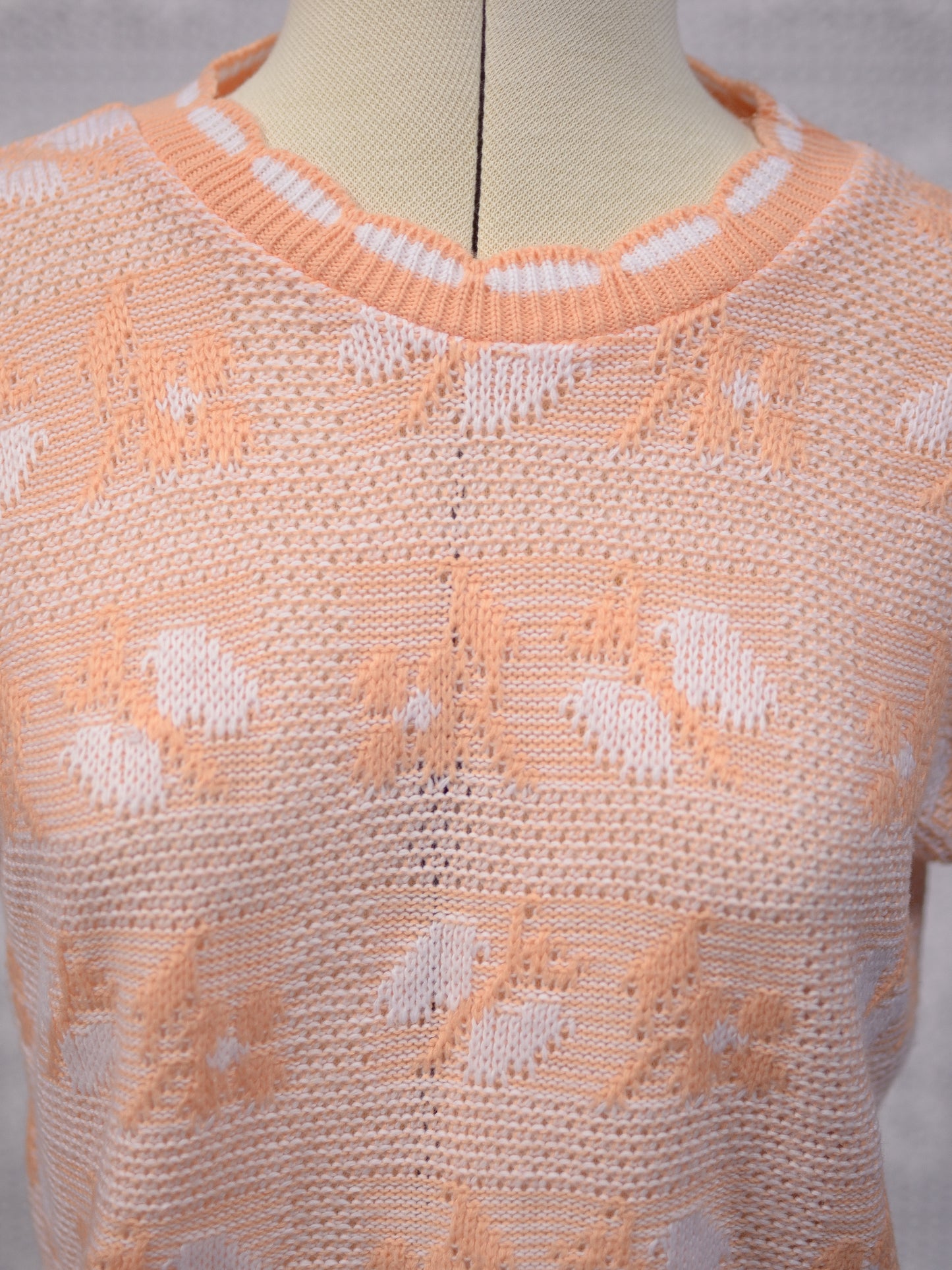 1980s peachy orange and white sleeveless jumper sweater vest