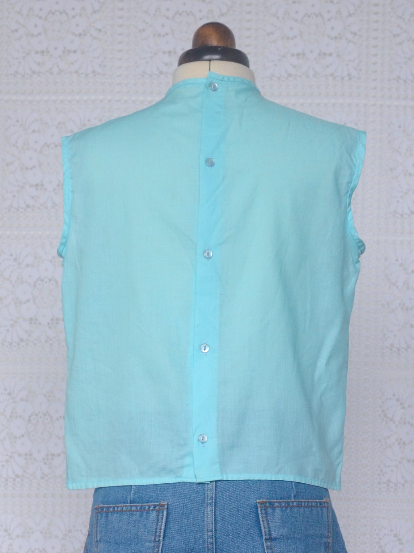 1960s Devonshire Lady light blue cropped broderie anglaise sleeveless button back top