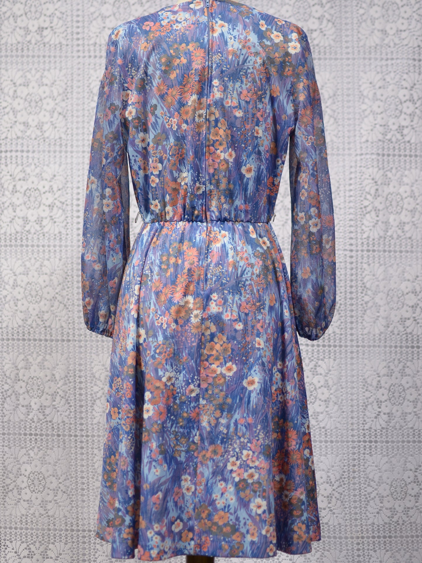 1970s blue and orange floral fit and flare dress with balloon sleeves