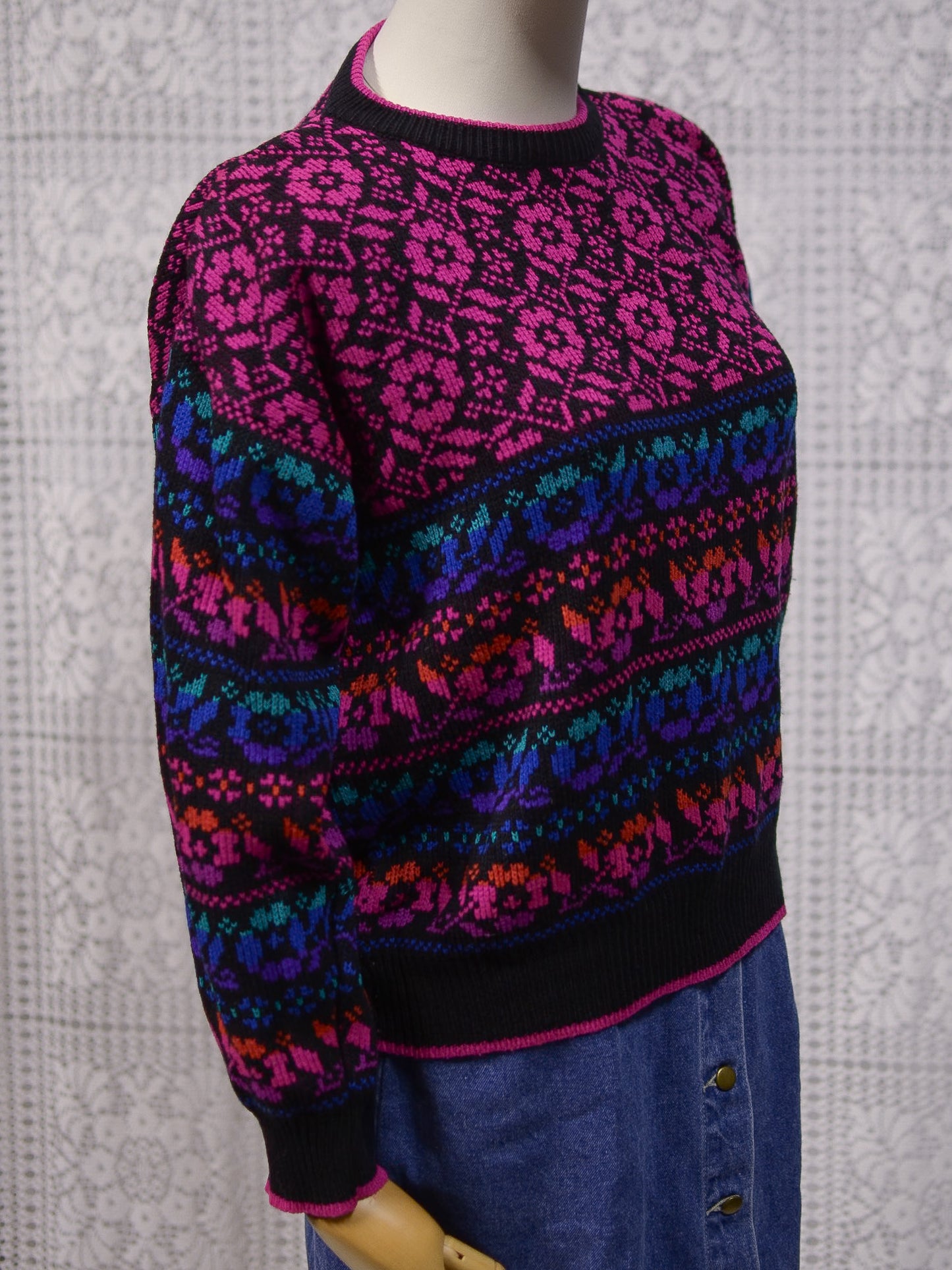 1980s black, pink, blue, purple and green floral pattern jumper