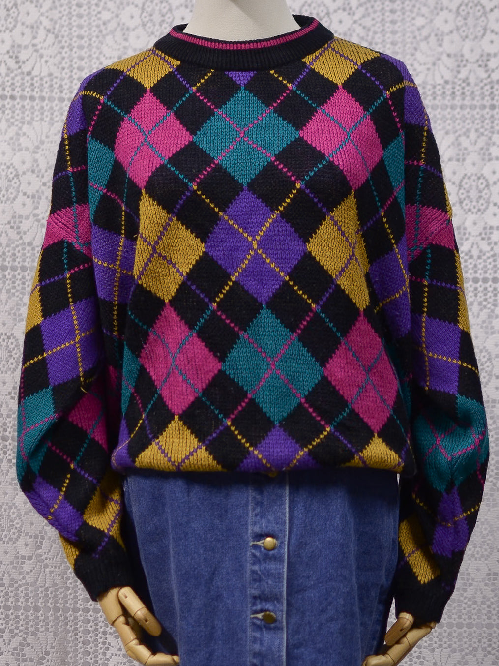 1980s black, pink, yellow, purple and turquoise green argyle pattern jumper