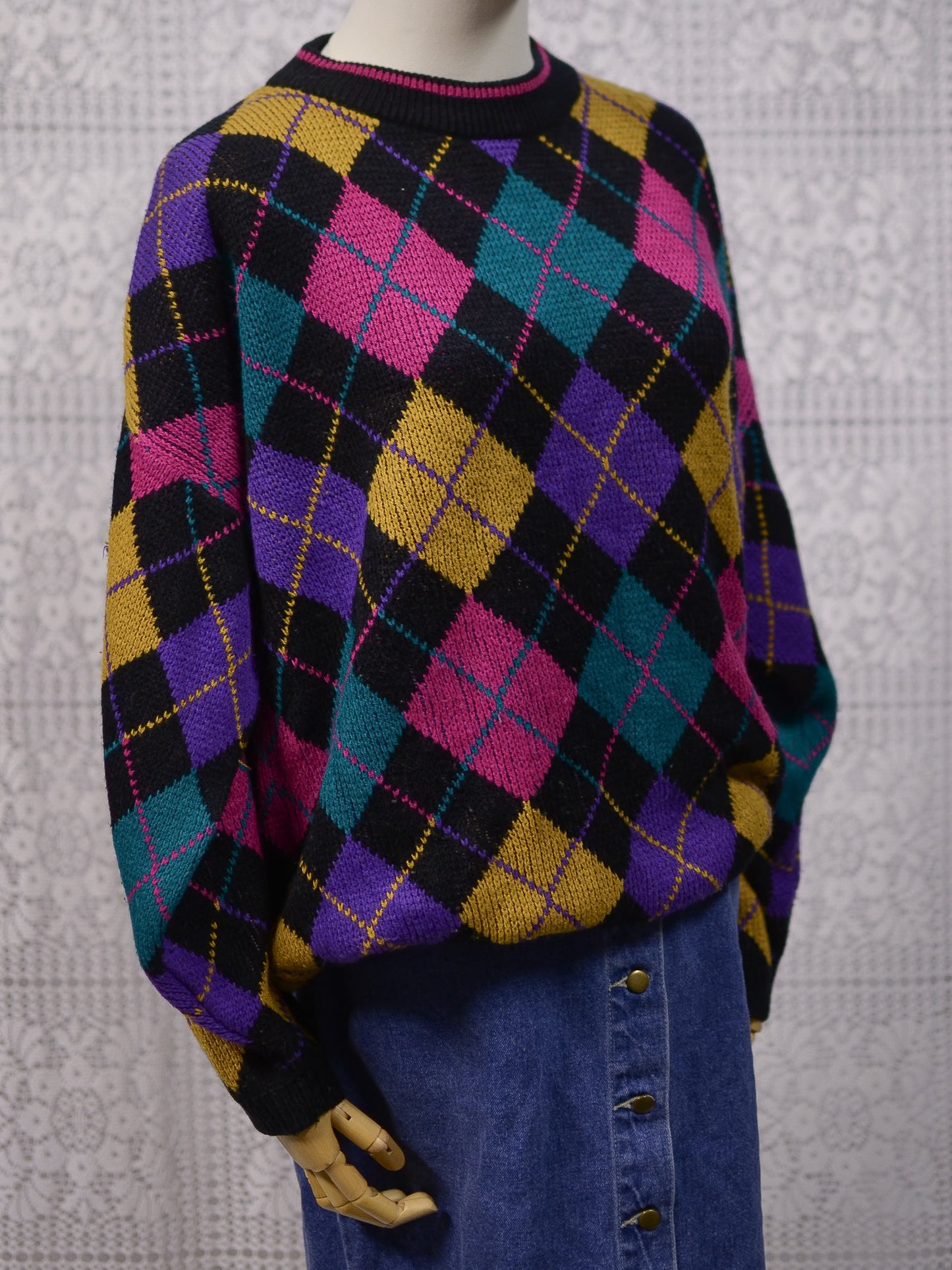 1980s black, pink, yellow, purple and turquoise green argyle pattern jumper